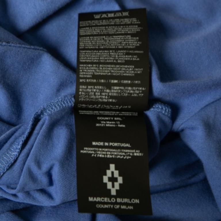 Ce t-shirt de Marcelo Burlon permet d'arborer un style classe et confortable. Confectionné en coton imprimé bleu, il présente des manches courtes et un col ras du cou. Ce T-shirt est idéal pour une utilisation décontractée.