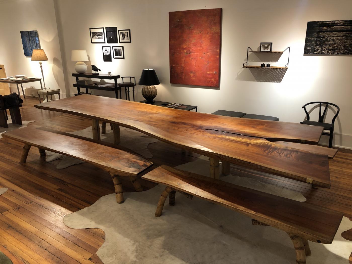 Exceptionally large table and benches crafted out of a single slab of cedar with cast bronze hardware details by the columbian architect and designer Marcelo Villegas.
The legs of the table are ‘guadua’ bamboo and the legs of the benches are the