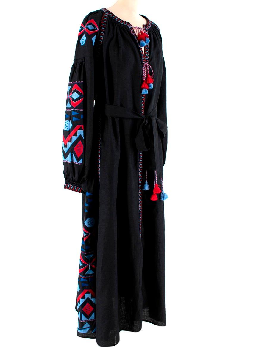 Black Linen Embroidered Tie-Waist Maxi Dress

- Maxi design 
- Long length elasticated sleeves
- Blue and red embroidered detailing 
- Belted tassel tie waist 
- Tassel tie neck 
- Split side seams
- Side pockets
- Concealed front press-stud