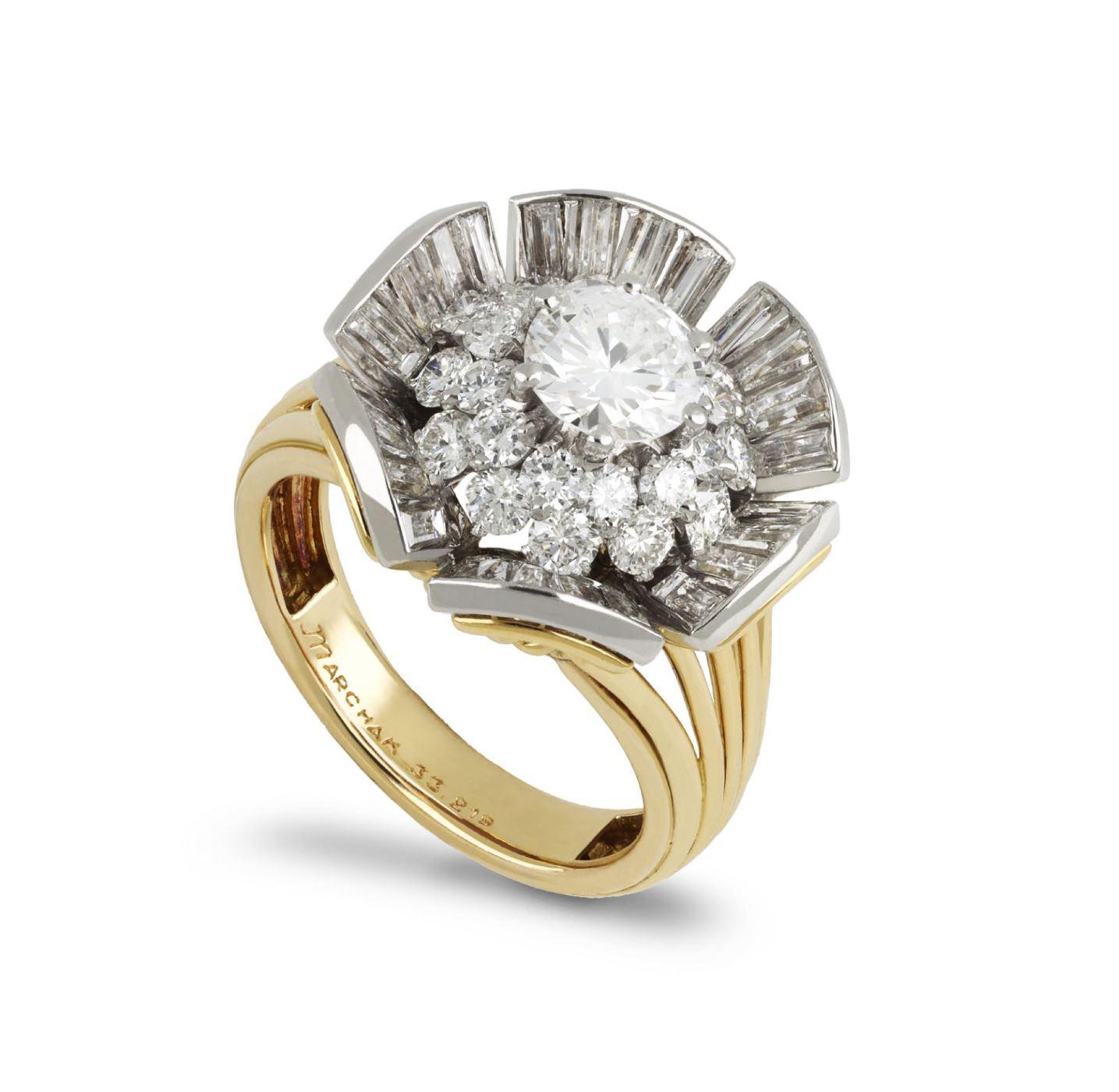 Marchak diamond cocktail ring. Set to centre with a round brilliant cut diamond in an open back claw setting with an approximate weight of 1.14 carats, encircled by twenty-four round brilliant cut diamonds in open back claw settings with a combined