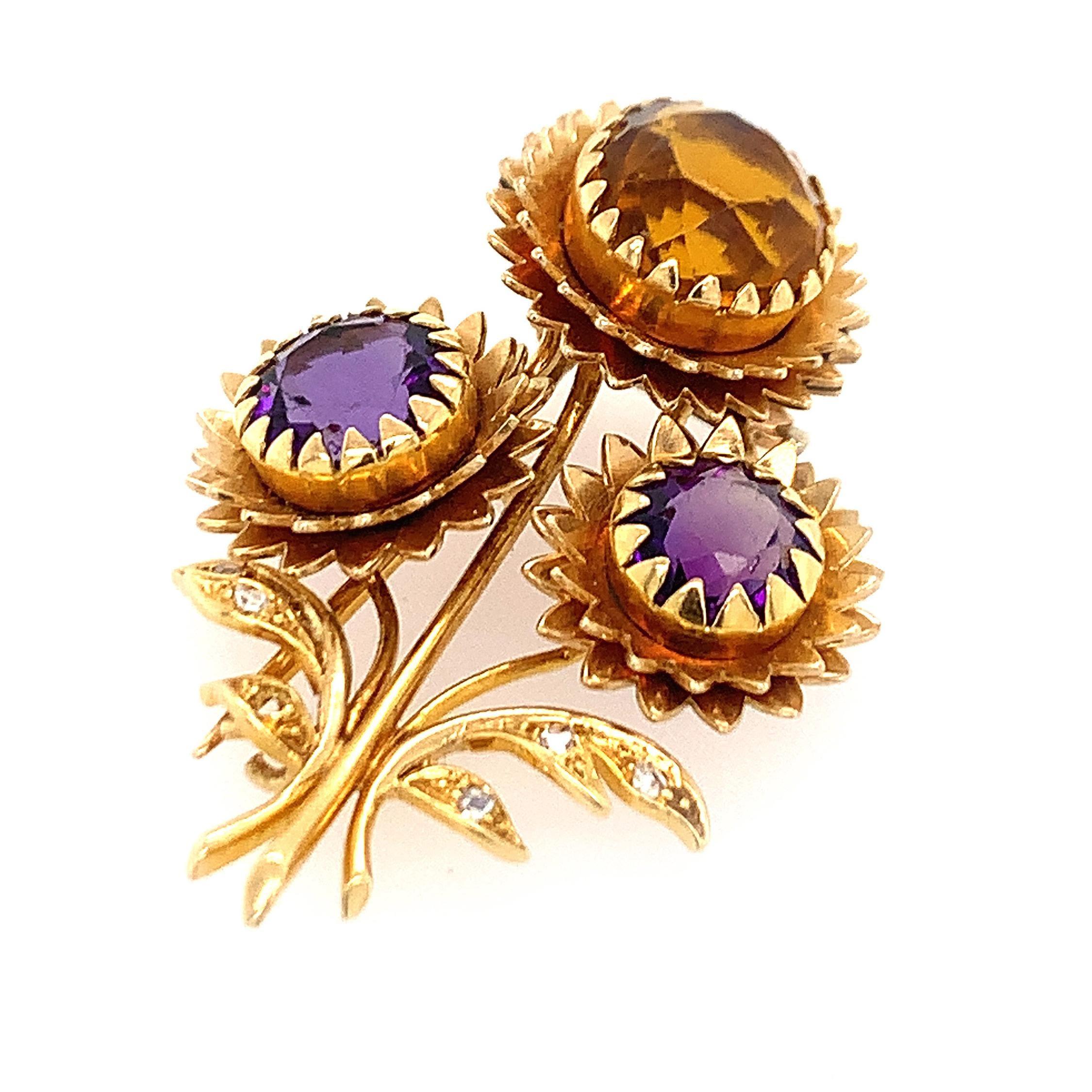 18K Y/gold sunflower pin, with two amethyst and one citrine and rose cut diamonds (one small diamomd missing will be replaced upon purchase. signed Marchak Paris 23683 and French hallmarks, pin meausres 1 1/2 x 1 1/8 inches, weight 8.5 dwt.