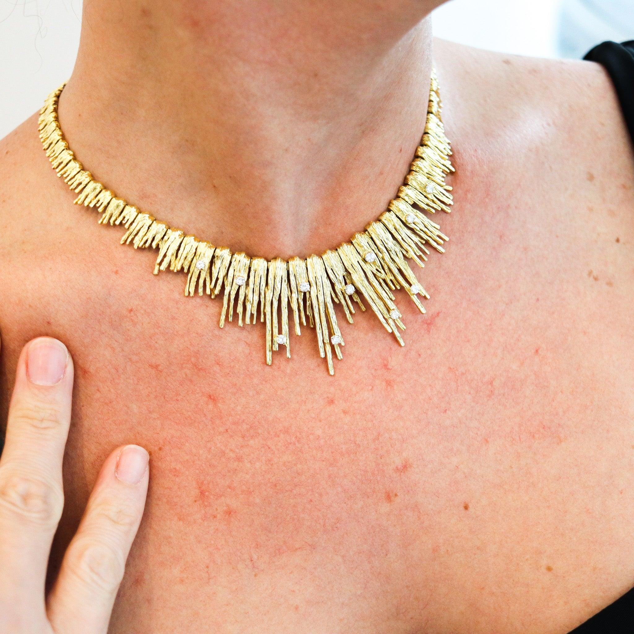 Necklace designed by Marchak Paris.

This fabulous necklace with rigid fringes, was crafted in Paris France by the jewelry house of Marchak, back in the late 1950. The unusual necklace was crafted in solid yellow gold of 18 karats with textured