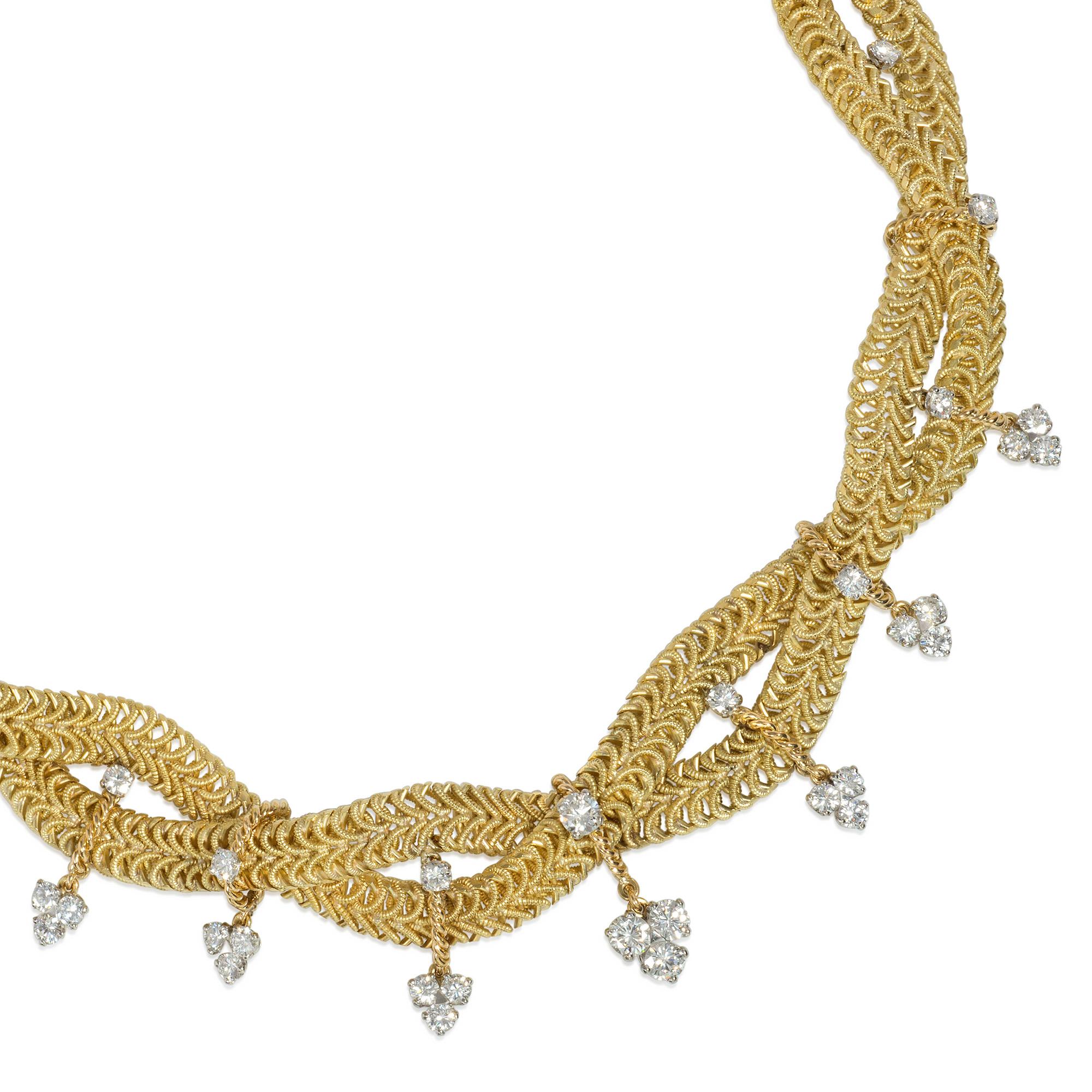A Mid-Century textured gold and diamond necklace of two-strand braided design, embellished with round brilliant-cut diamonds and further suspending trefoil clusters of round brilliant-cut diamonds, in 18k and platinum.  Marchak, Paris. #4699.  Atw