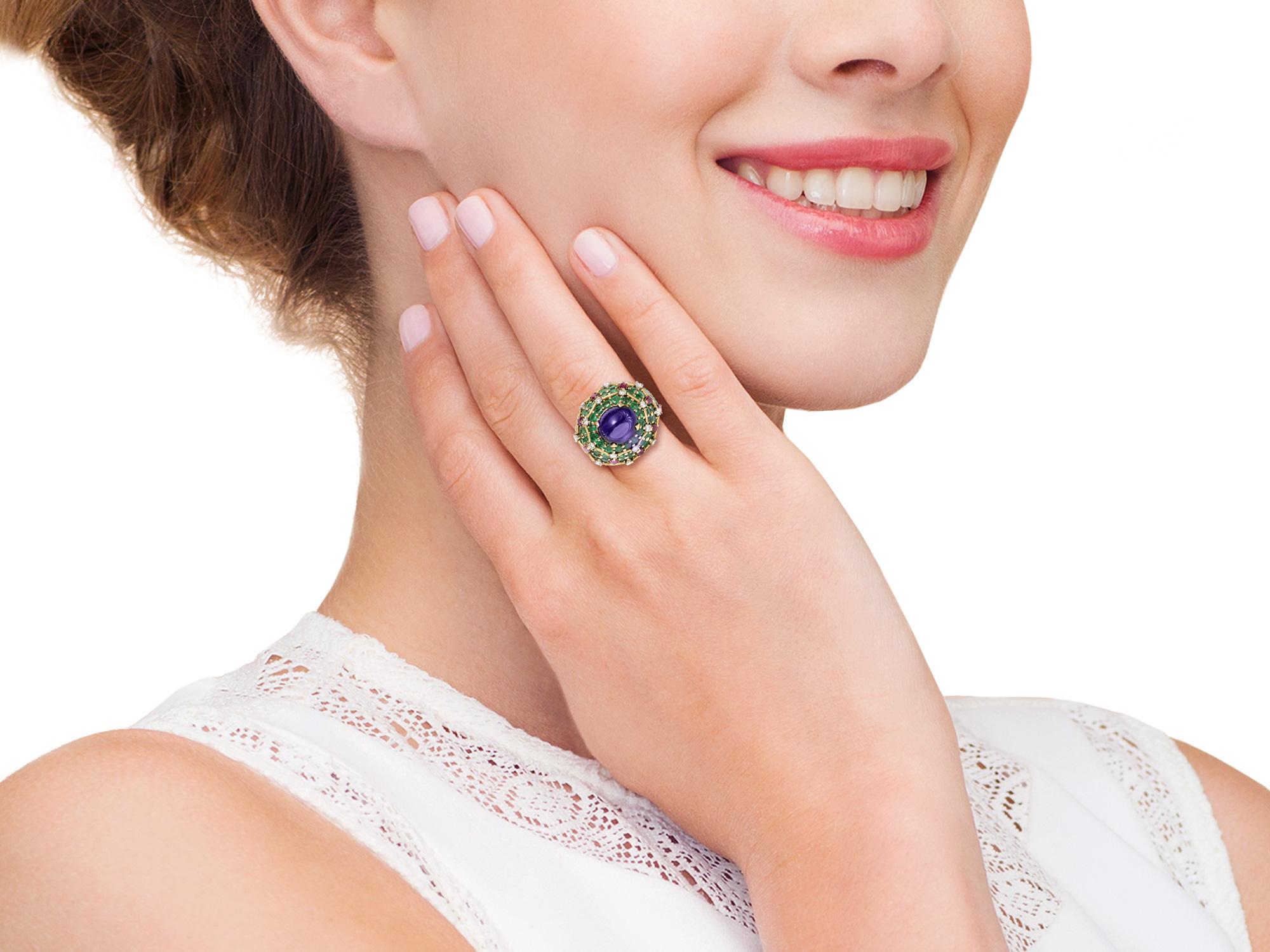 Marchak Paris Dome Ring with a center cabochon amethyst surrounded with emeralds, rubies and diamonds mounted in 18k yellow gold.  Signed Marchak Paris, no. 33426