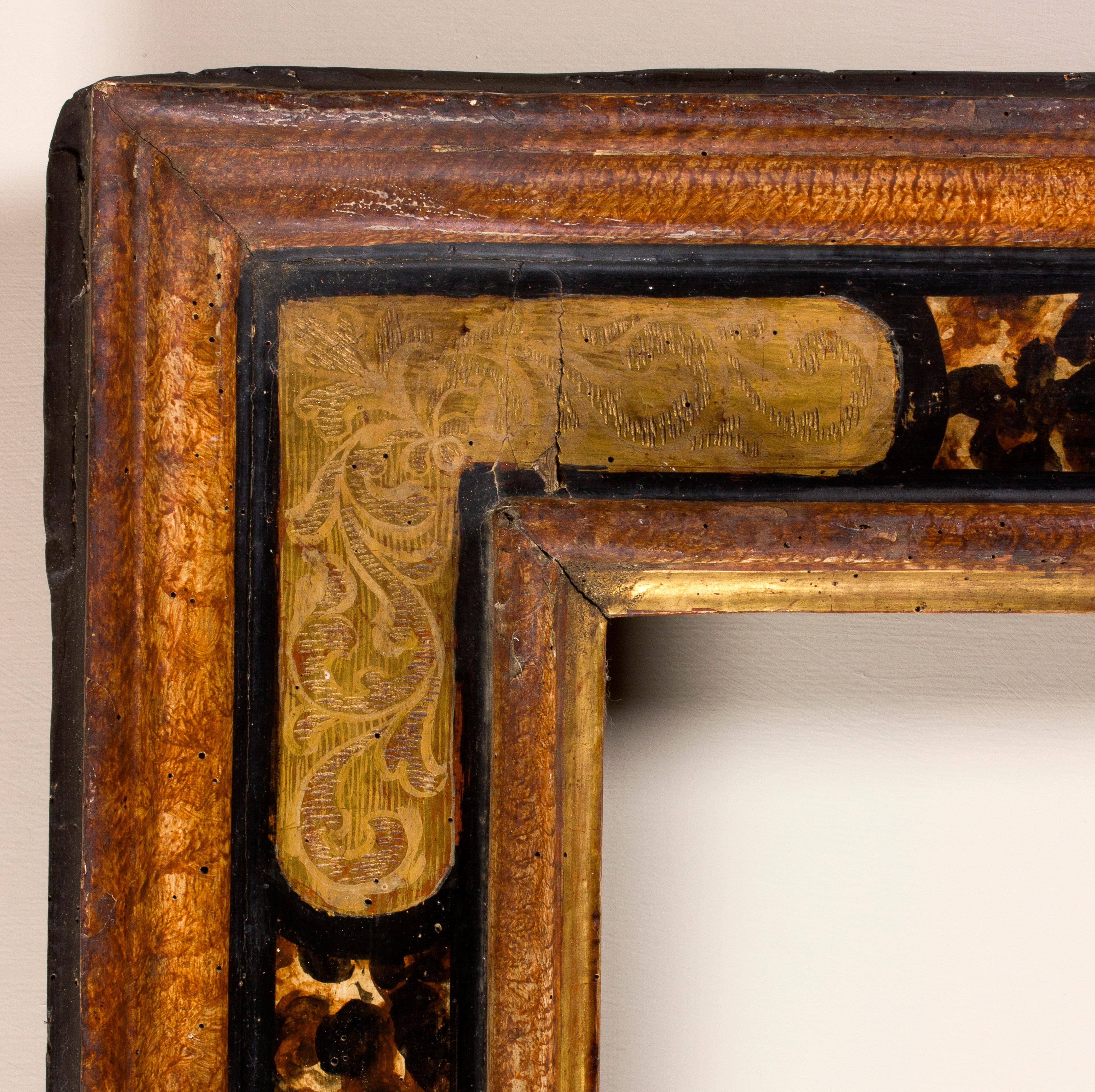 Marche frame, Italy, end of 16th century
Faux-tortoiseshell and faux marble painted cassetta frame, golden corners painted with leaf patterns.
Inside: 70.8 x 50 cm; outside: 99.2 x 77.6 cm.
Depth is the wide of the band.
 