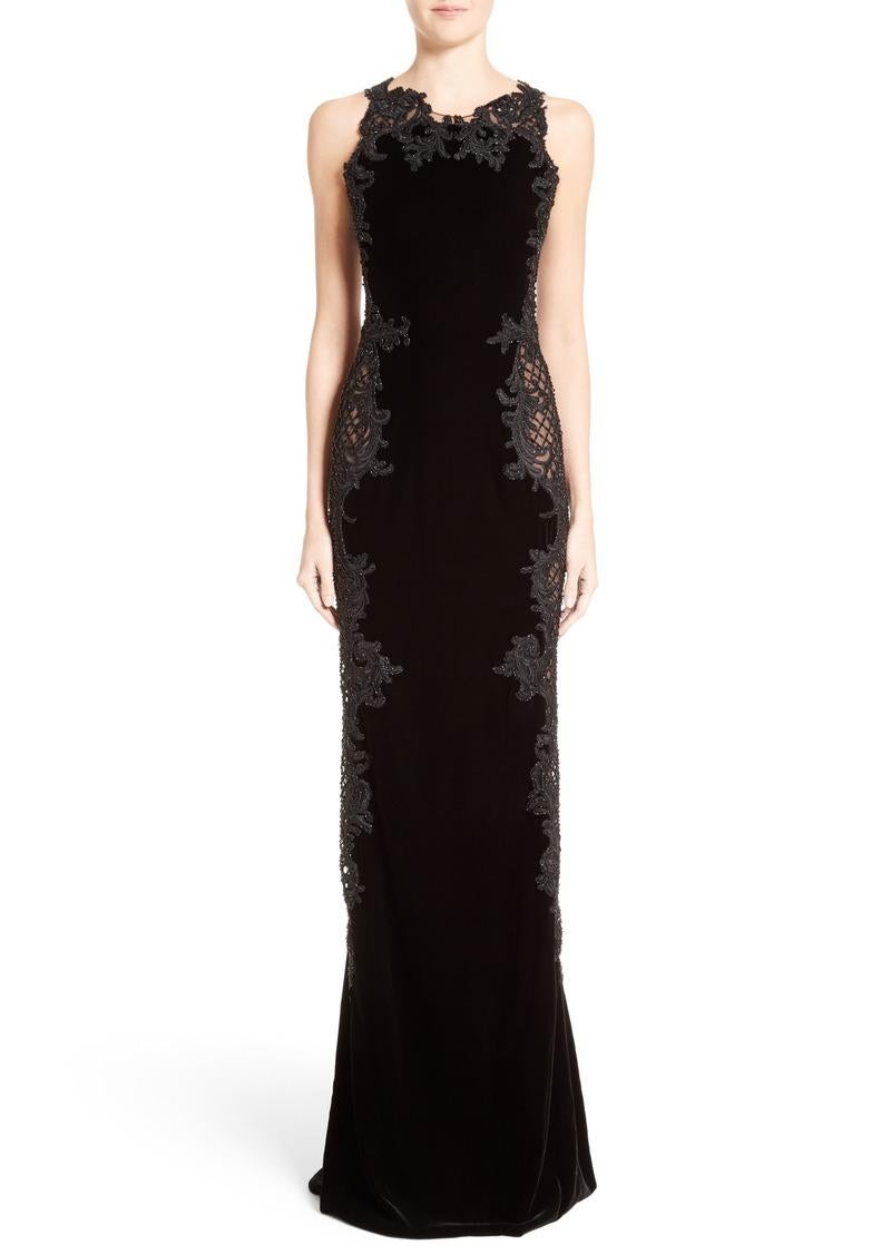 Marchesa Black Velvet Baroque Scroll Inspired Embroidery Tull Dress Gown
A look at once classic and modern, elegant and edgy—a black-velvet column gown takes on extravagant allure with lavishly embellished panels of embroidered tulle running down