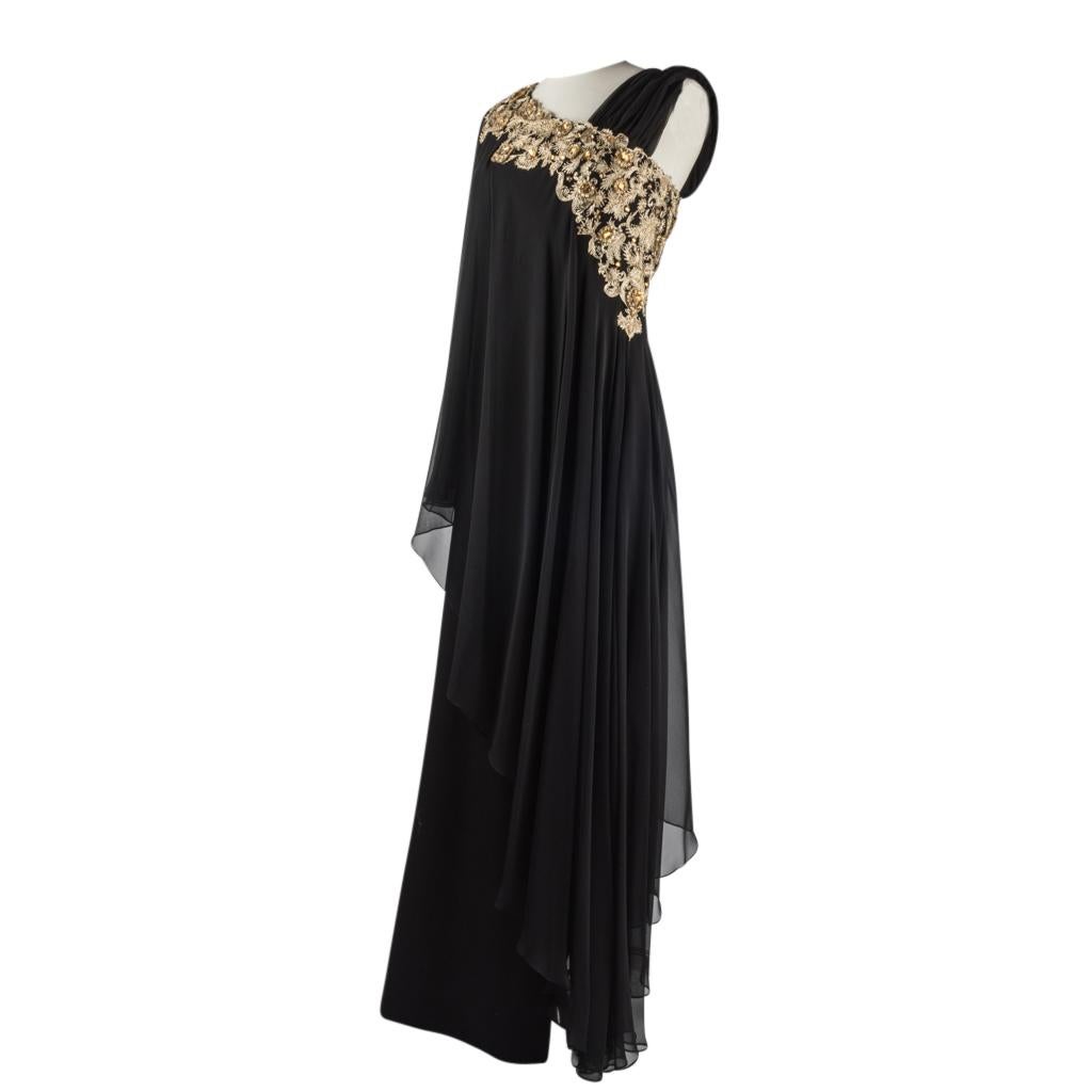 
Guaranteed authentic Marchesa black gown features assymetical one shoulder style embroidered jeweled neckline.
Pencil dress has 21.75