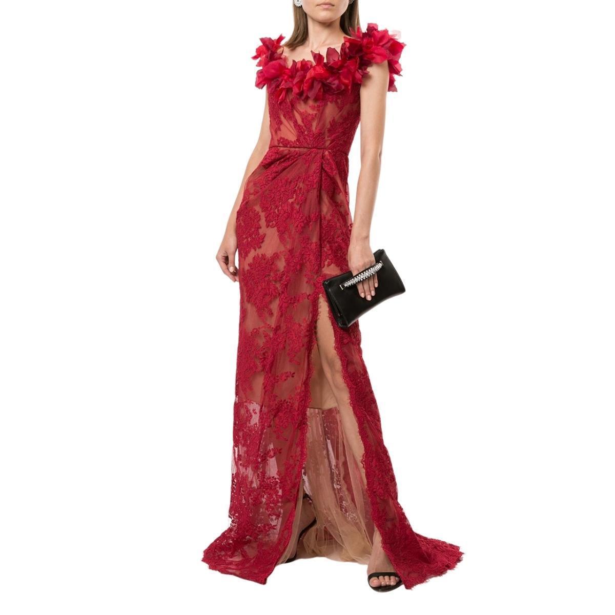 This exquisite gown is topped with a diaphanous floral appliqué across an off-the-shoulder neckline, mirroring the florals in its lace overlay. It has a subtle drape at the hip and a cut-up-to-there side slit edged with delicate scallop