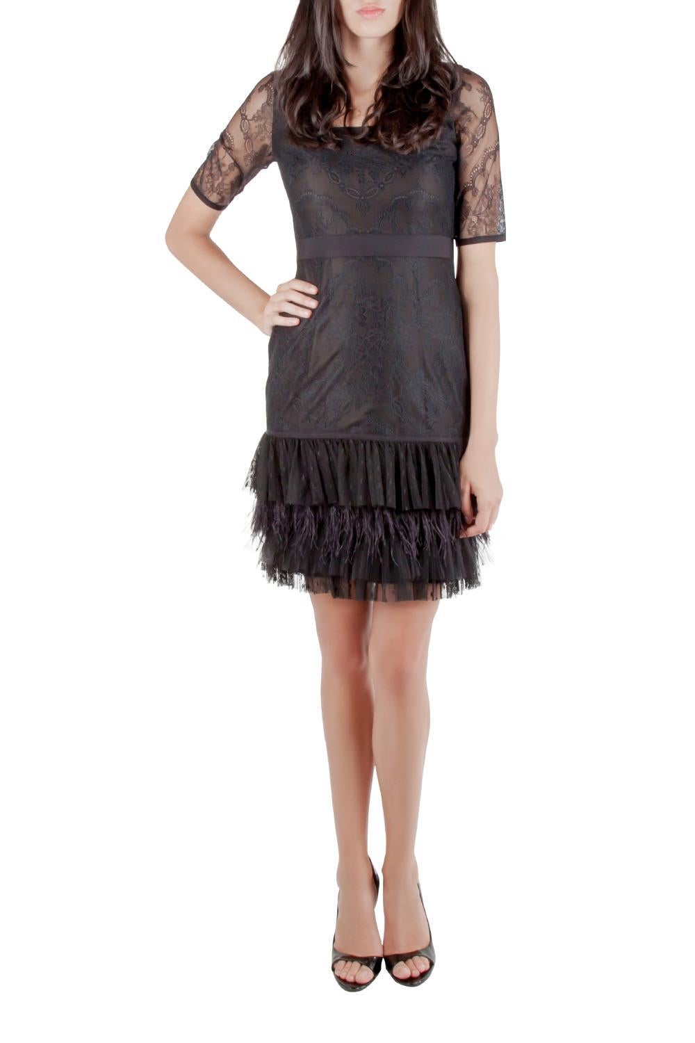 Marchesa has made this fabulous cocktail dress with each element reflecting the designer's fascinating creativity. It is tailored in a combination of black fabrics, featuring an exquisite lace pattern. The piece comes with feather fringes inserted