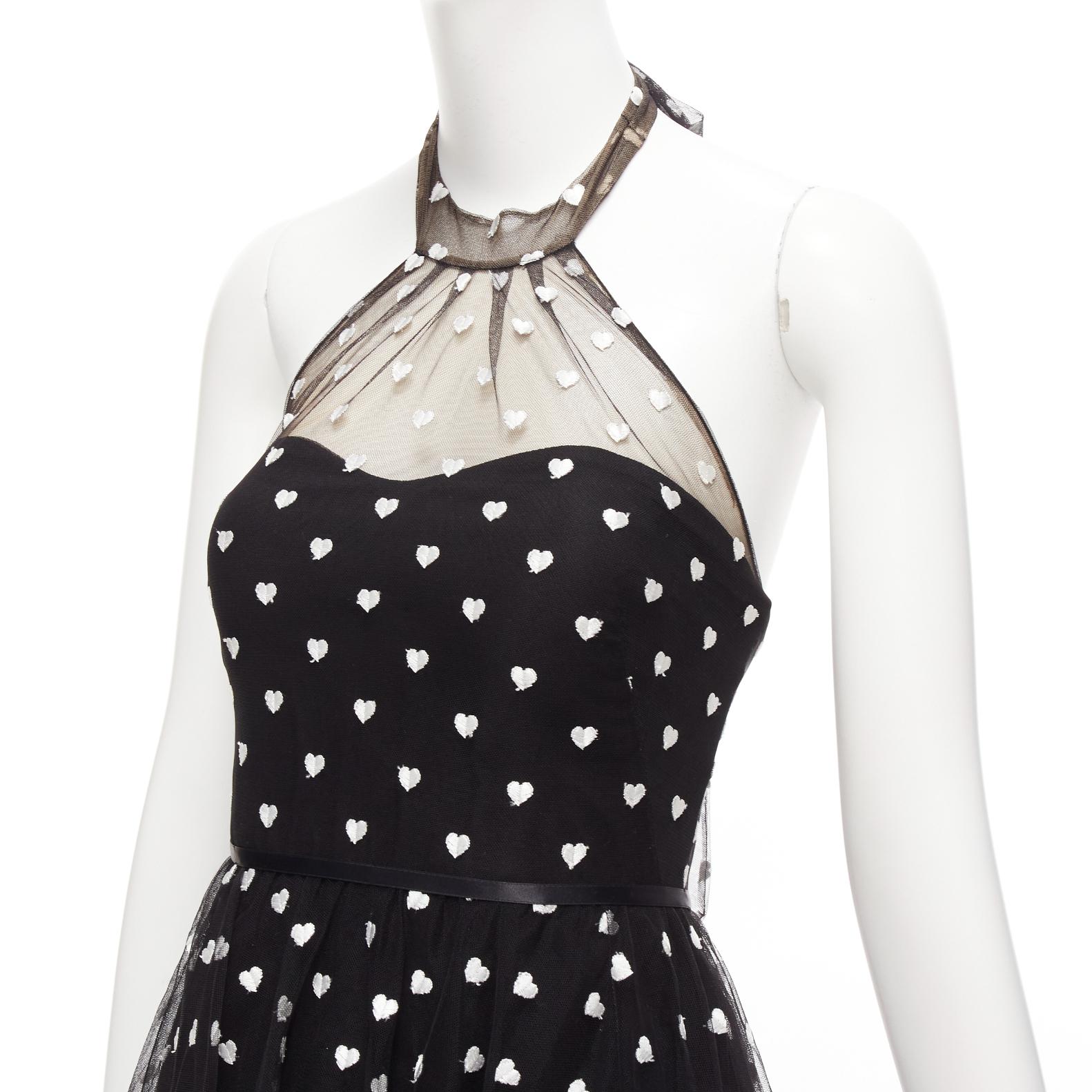 MARCHESA NOTTE black mesh white heart embroidered halter neck tiered gown US0 XS
Reference: YIKK/A00005
Brand: Marchesa
Collection: NOTTE
Material: Polyester, Nylon
Color: Black, White
Pattern: Heart
Closure: Zip
Lining: Black Polyester
Extra