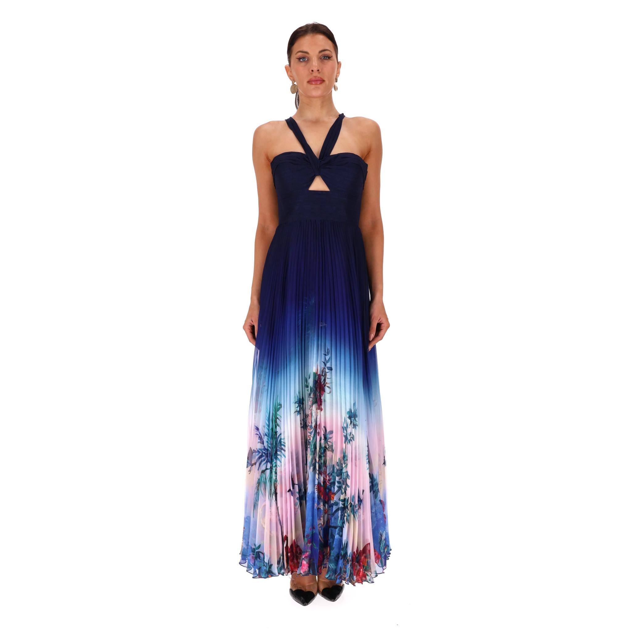 Brand New - Marchesa Notte - Abito in Plissé-Chiffon con dettaglio cut-out e fiori Ombre

Abito da sera in chiffon blu navy che sfuma in una stampa floreale multicolore sulla maxi gonna a pieghe.

Caratterizzato da una scollatura halter con un