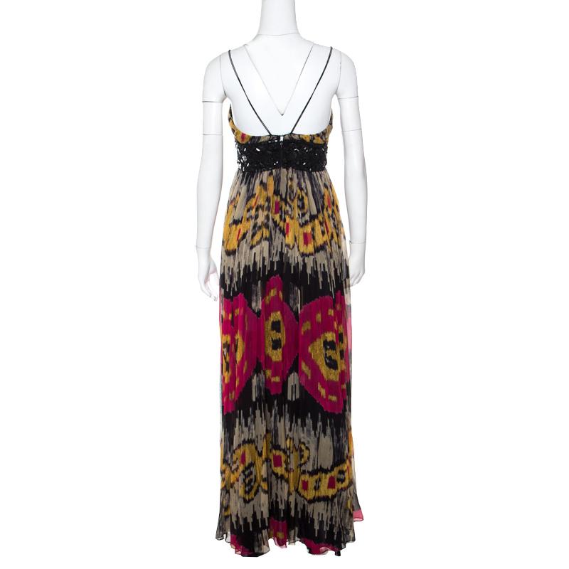 Designed as a sleeveless, this Marchesa Notte gown comes tailored from quality silk and designed with Ikkat prints all over and an embellished panel that releases a flowy skirt. This gown can be assembled with simple ankle strap sandals for a