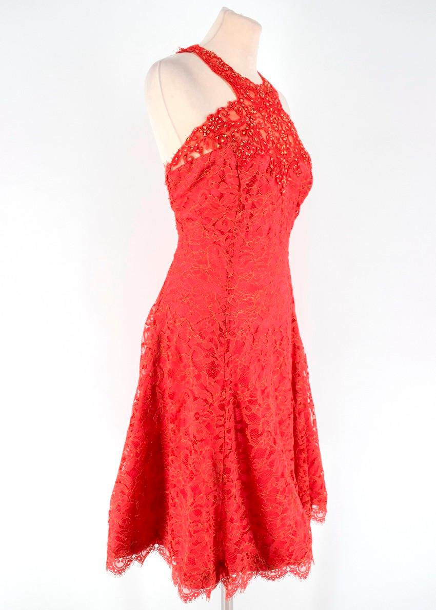 Marchesa Red Lace Dress

- Sheer dress with pink lining
- Gold toned beading embellishment on dress
- Zip with hook and eye closure at the back
- Fit and flare
- Mini dress with halter neck

Please note, these items are pre-owned and may show signs
