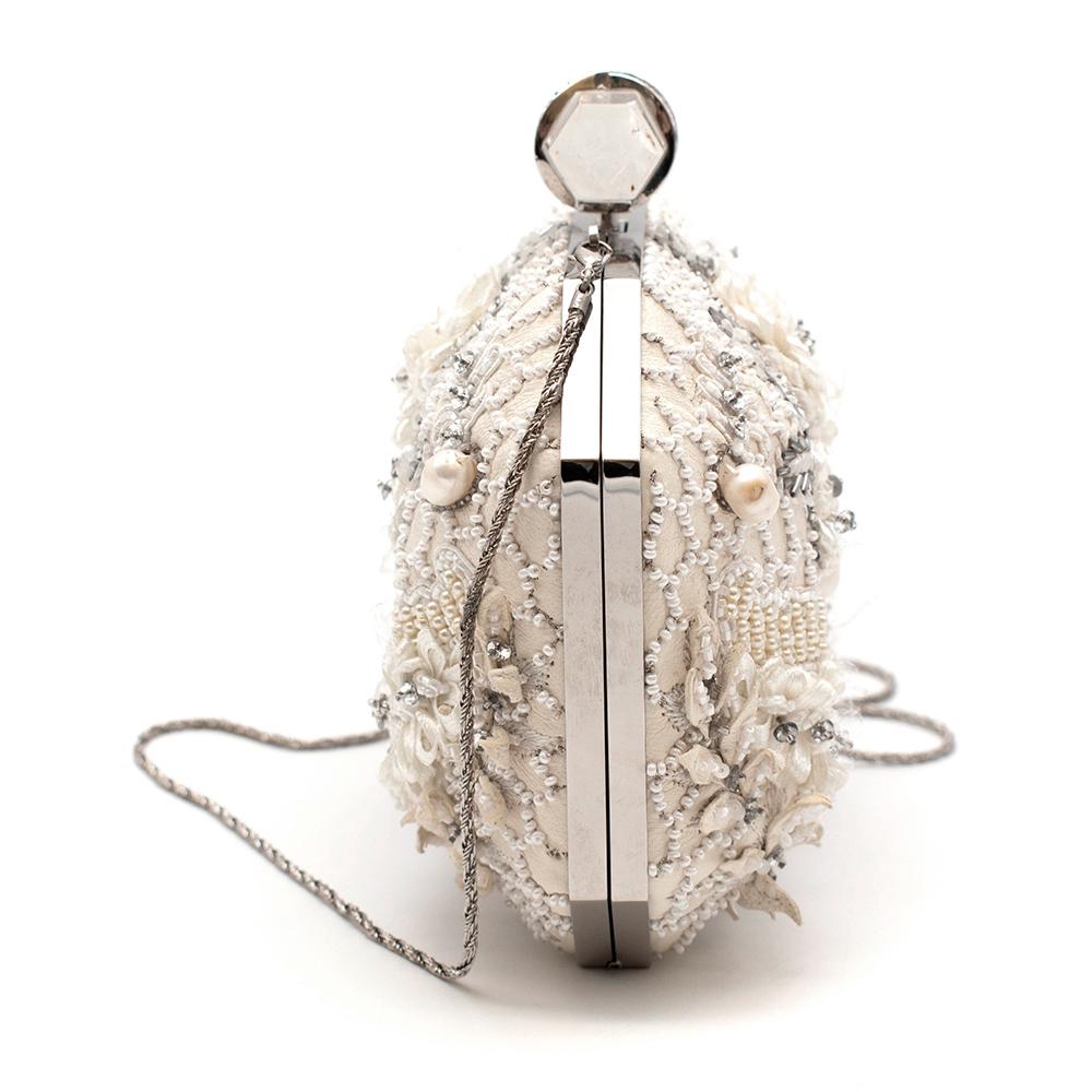 Marchesa White Iris Embellished Leather Box Clutch Bag

- Ivory leather
- Intricately embellished with pearls, crystals and a floral-shaped ribbon  
- Quartz push clasp fastening at top
- Satin and tulle-lined interior 
- Detachable chain shoulder