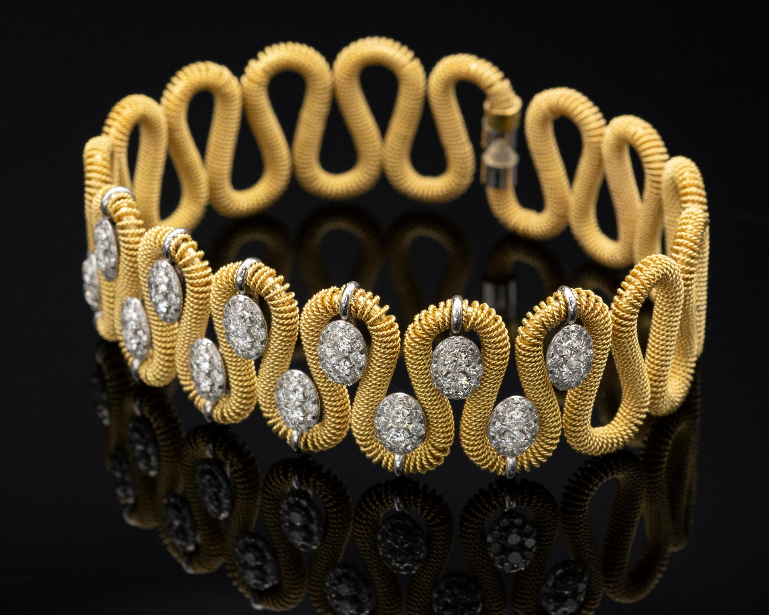 Exquisite 18KT gold cuff bracelet, Entirely hand crafted by Marchisio italian jewellers since1859. The bracelet folds around the wrist and fits all sizes. 
Diamonds: 2.4 carats 
Gold : 24.5 gr

Matches Necklace Ref: LU47232577983
And Earrings Ref: