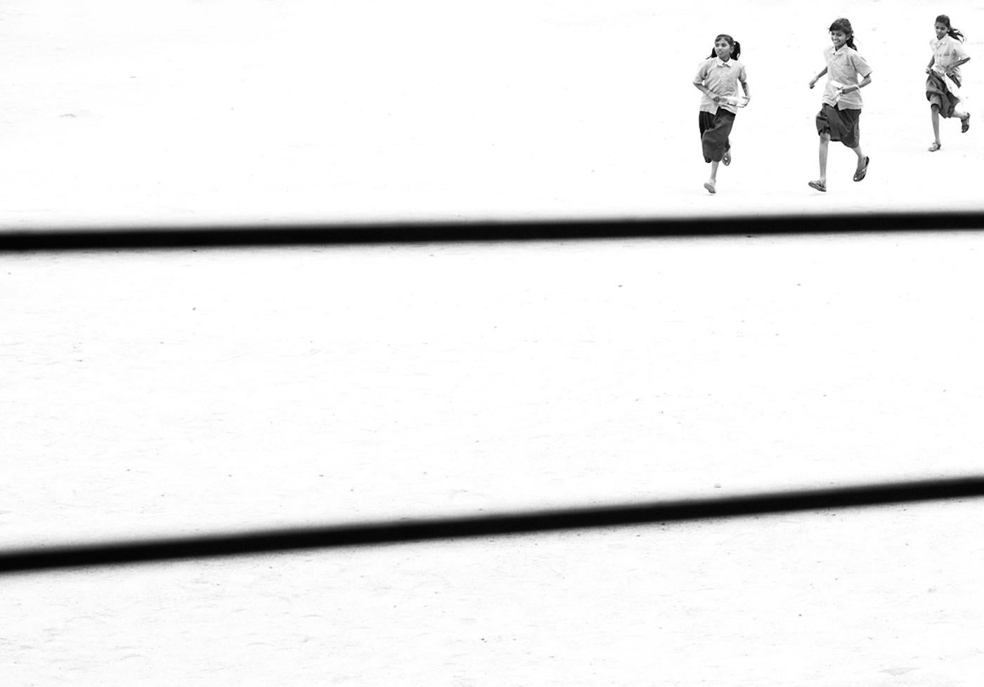 Marcin Ryczek Figurative Photograph - Running - Contemporary Minimalist Street Photography, Black And White