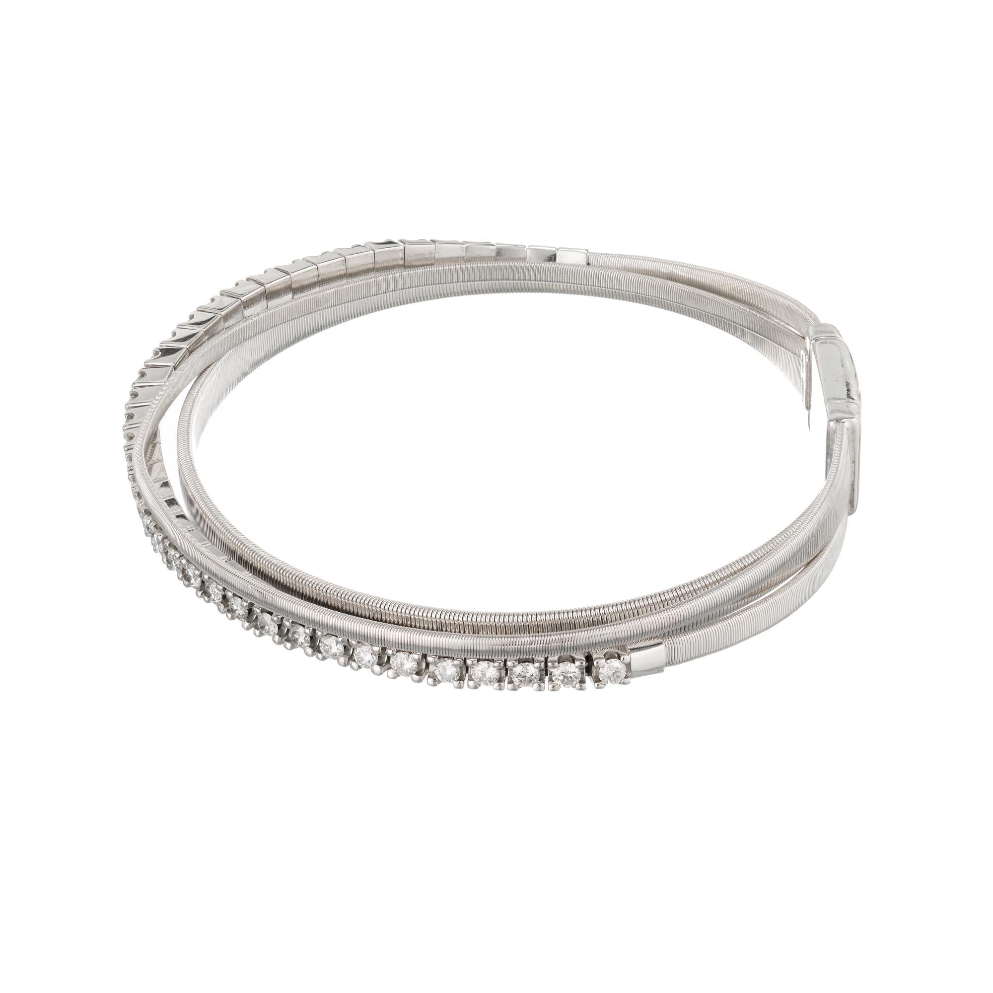 Marco Bicego diamond 18k white gold three strand bracelet from the Masai collection.

38 round brilliant cut H VS diamonds, Approximate 1.14cts
Total length: 6.75 Inches
18k white gold 
Stamped: 750
Hallmark: Marco Bicego 
21.1 grams
Width: