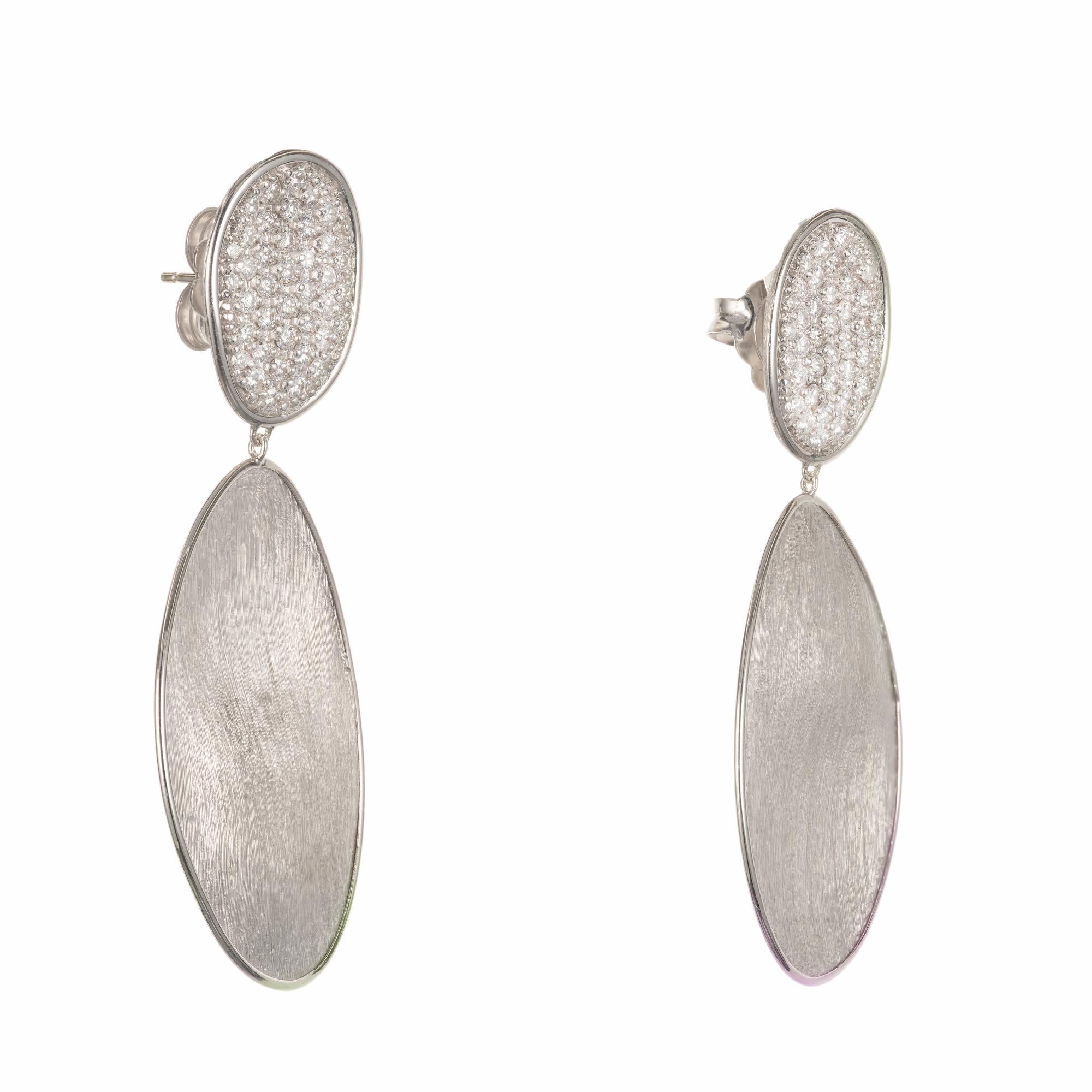 18k white gold drop dangle earrings from the Marco Bicego lunaria collection with pave round brilliant diamonds set into 18k white tops. An additional 18k white gold hand engraved drop hangs below for a total length of 2.25 Inches

78 round