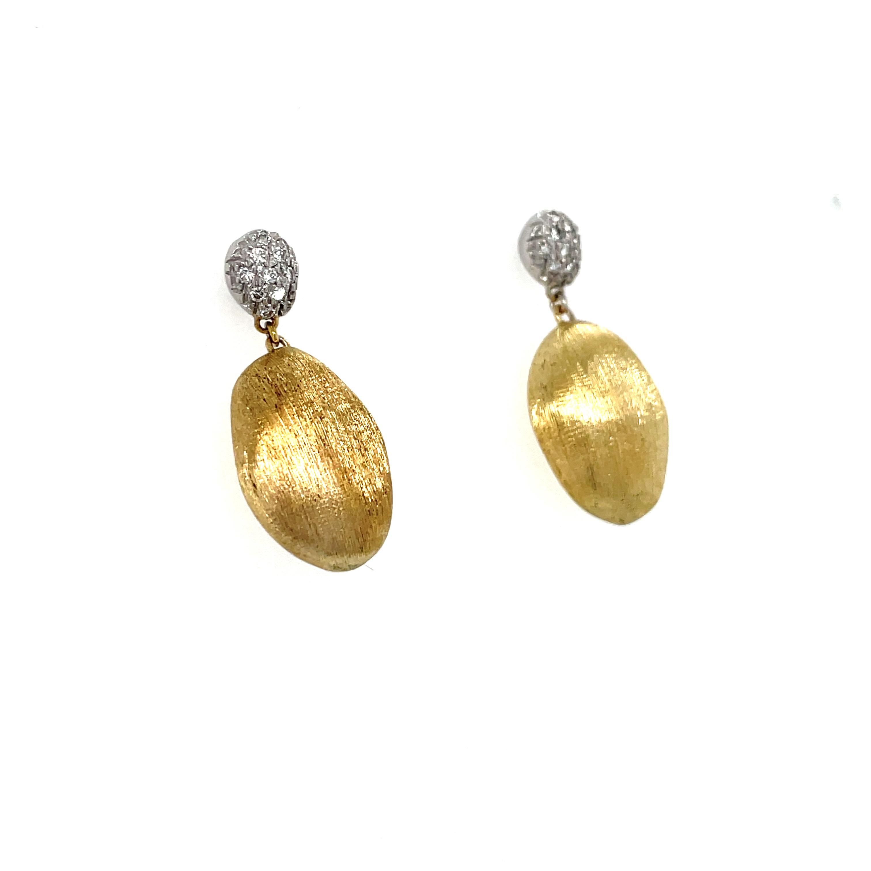 These gorgeous earrings by Marco Bicego contain hand engraved drops suspended by diamond tops containing round brilliant cut diamonds weighing approximately 0.20 carat total.

Measurements: 1 inch long
Stamp: MARCO BICEGO made in italy (Italian