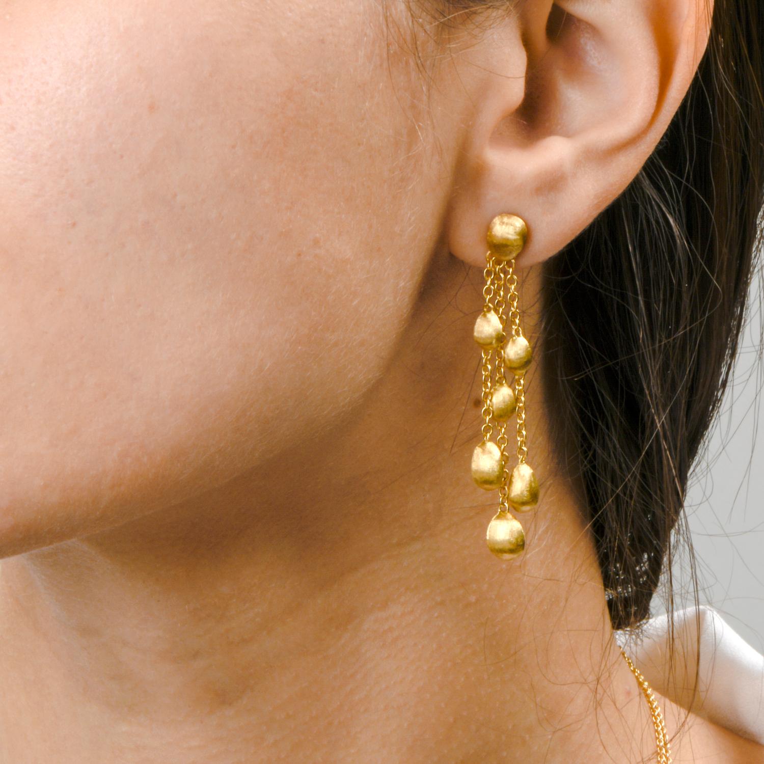 These beautiful earrings were created by Marco Bicego and 

crafted in 18K yellow gold.

Featuring 3 strands, each strand containing 2 

Bulino finished gold beads.

With every movement, there is motion.

Secured with Press on Friction