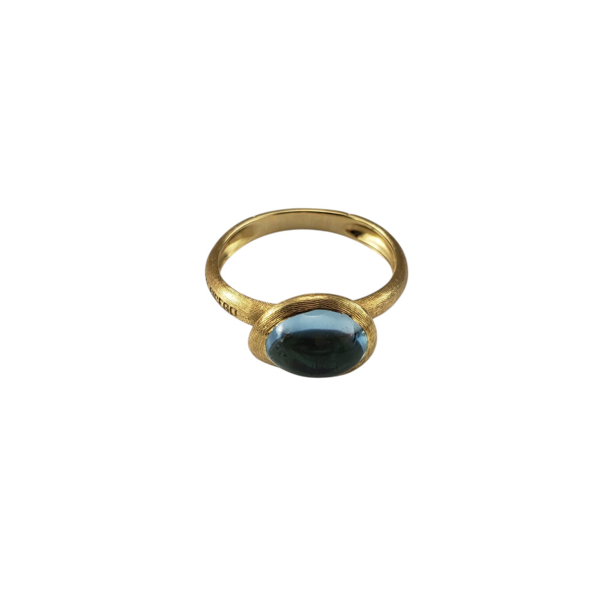 Marco Bicego 18K Yellow Gold and Cabochon Blue Topaz Jaipur Frame Ring Size 7.5

This exquisite ring features a cabochon cut blue topaz (9 mm x 7 mm) set in a handcrafted 18K yellow gold. The frame showcases Bicego's signature Bulino engraving