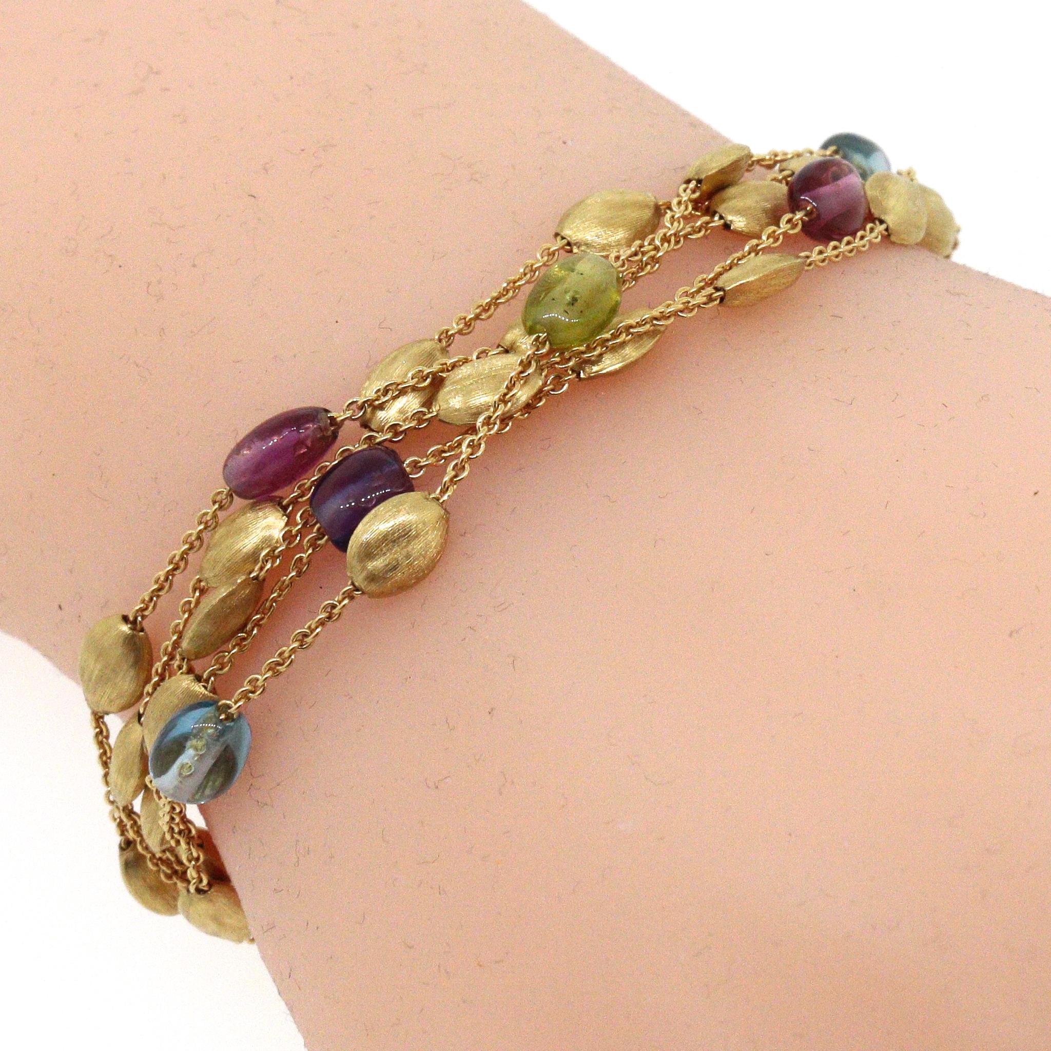 18 kt Yellow Gold - Brushed
Length: 7 inches
Semi-Precious Stones: Amethyst, London Blue Topaz, Peridot, Tourmaline
Total Weight: 16.58 grams﻿
Lobster Clasp Closure