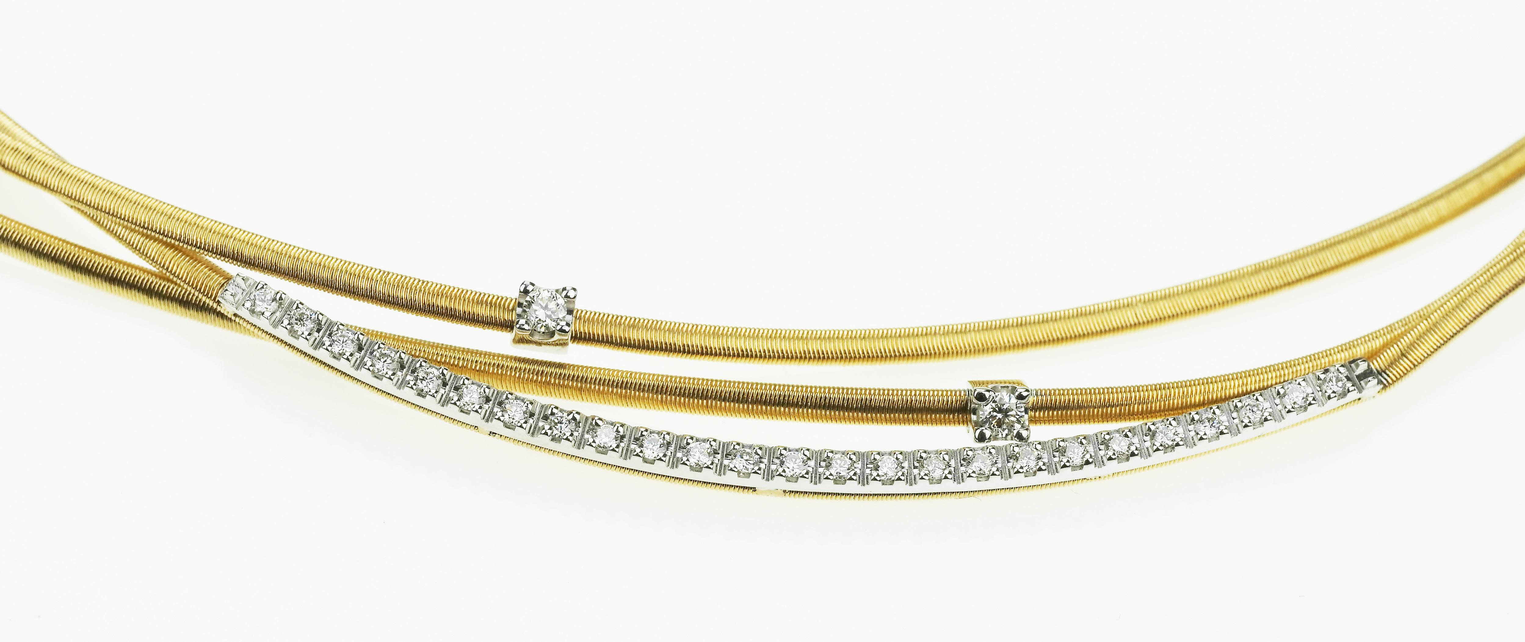 Marco Bicego 18 ct Yellow Gold Three Strand Diamond Set Necklace. 
This beautiful Marco Bicego necklace is hand made with the Corda di chitarra technique and set with round brilliant cut diamonds.
27 diamonds approximate total diamond weight 0.35