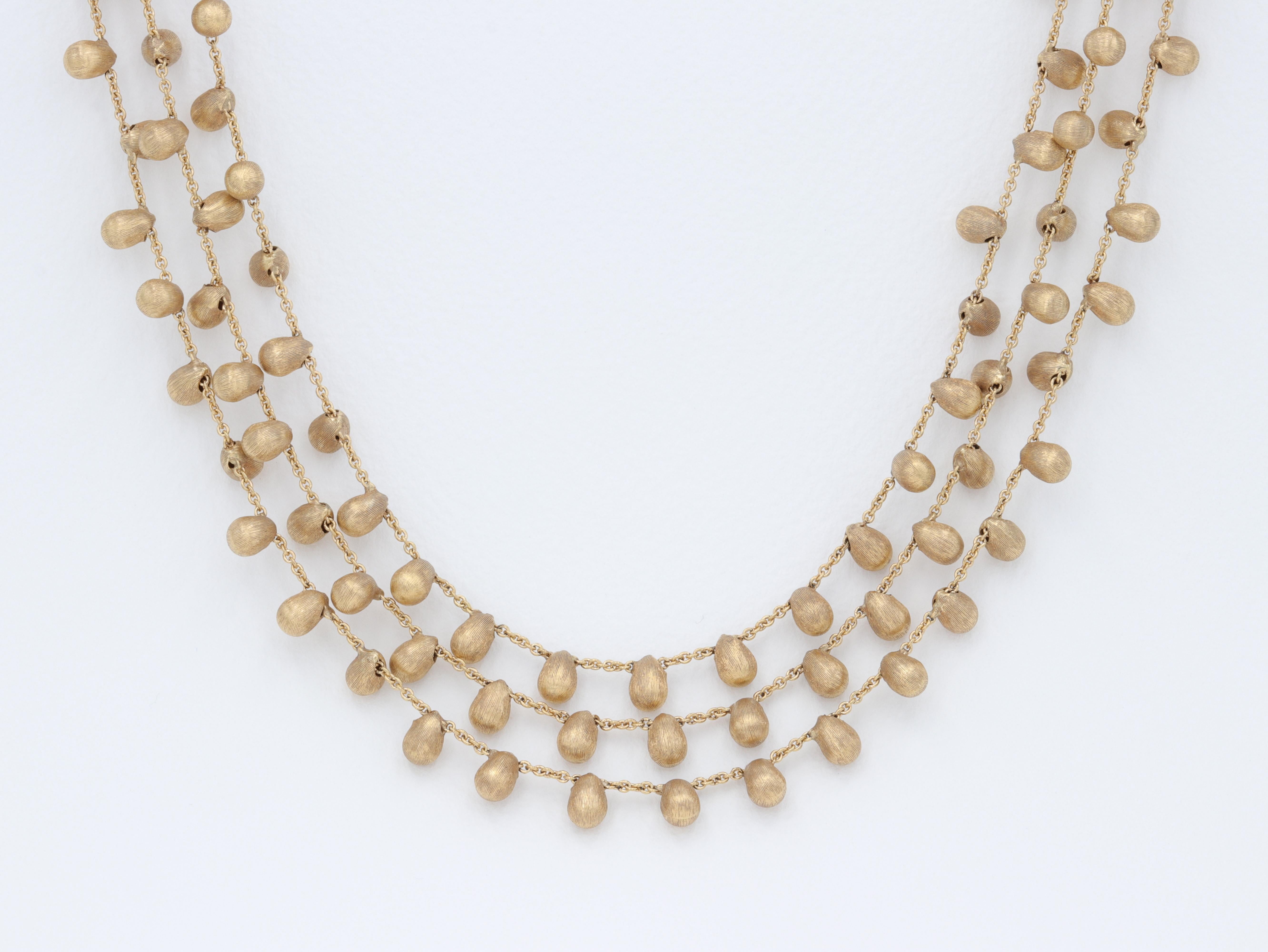 Marco Bicego 3 Strand Acapulco Necklace 18 Karat Yellow Gold

In like new condition.

3 Row layered style necklace, with a brushed finish.

Looking to complete the set? Check out the matching earrings and bracelet in our inventory. 

16 inch length. 