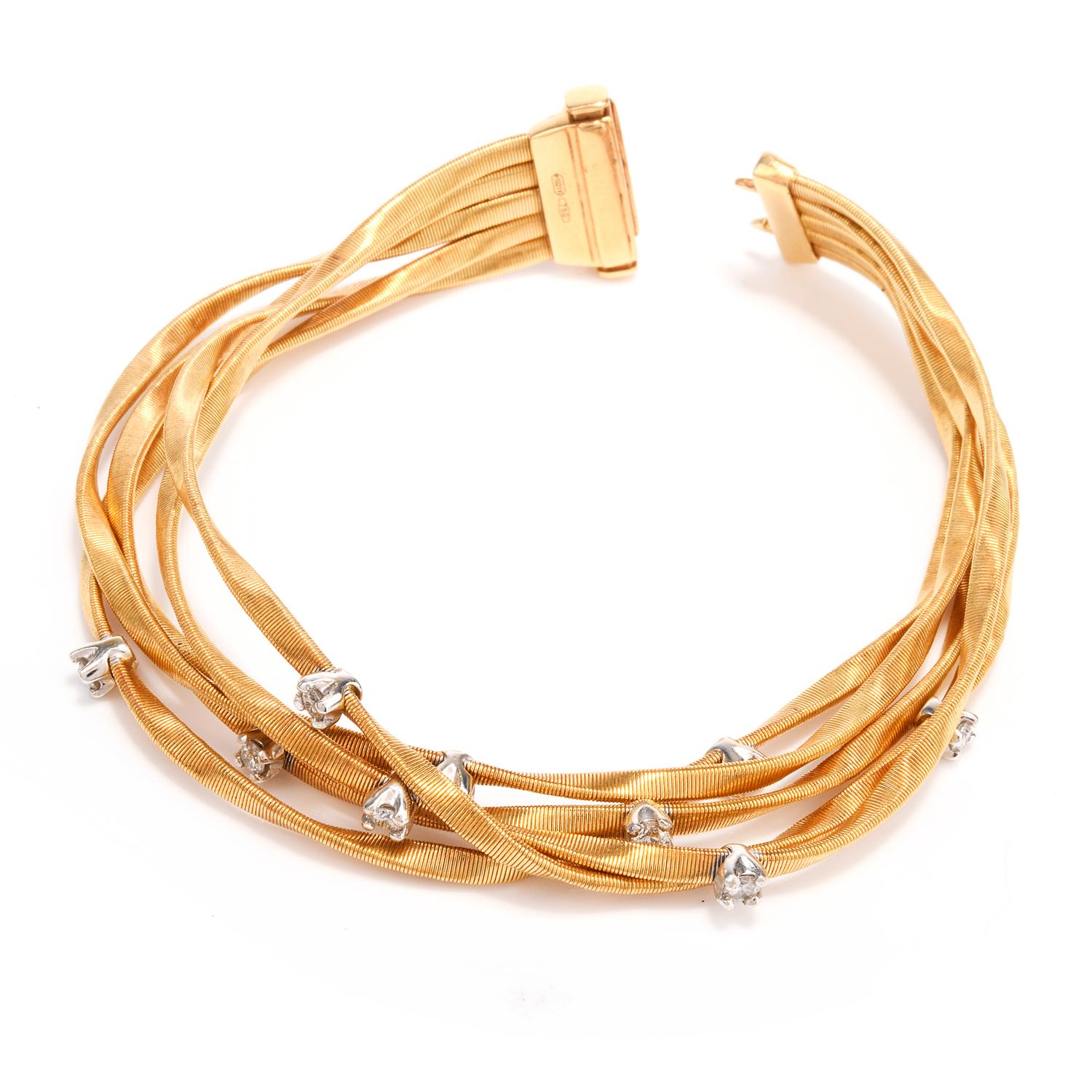 Designer Marco Bicego was inspired with a twisted coiled wire

design and crafted this in 18K yellow Gold.

With 5 strands stretched across the arm, each are accented 

with bright white round brilliant cut diamonds.

9 diamonds weigh appx. 0.63