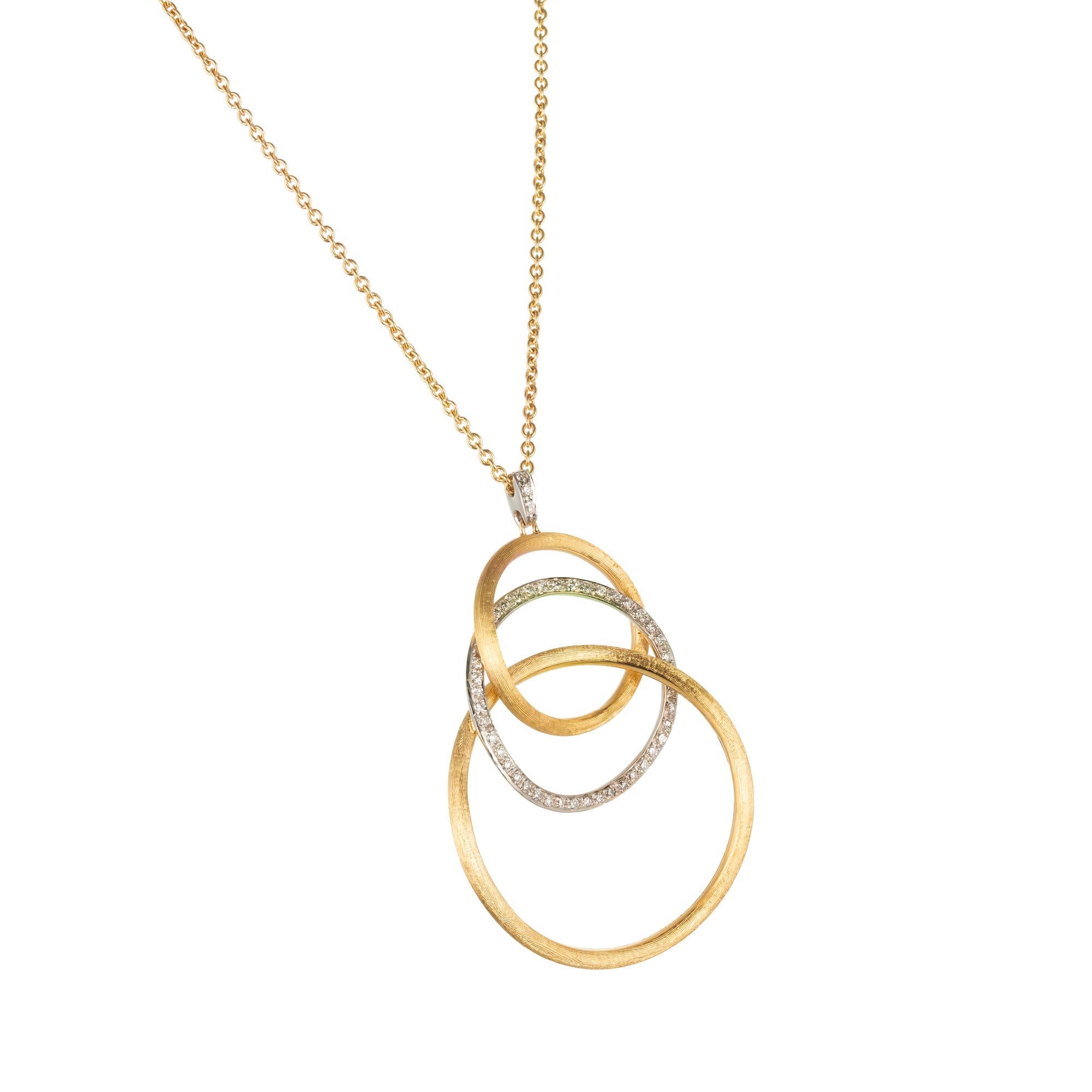 Marco Bicego 18k yellow and white gold diamond circle pendant from the Jaipur collection. 18k gold rings in three sizes interlink and form and elegant pendant that floats on an 18k yellow gold link chain with a lobster claw.  The middle link is pave