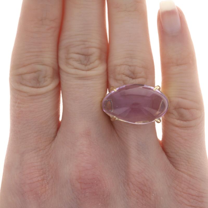 Size: 7 3/4
Sizing Fee: Up 2 sizes for $150 or Down 1 size for $150

Brand: Marco Bicego

Metal Content: 18k Yellow Gold

Stone Information
Natural Amethyst
Cut: Freeform Cabochon
Color: Purple

Style: Cocktail Solitaire
Features: East-West Set