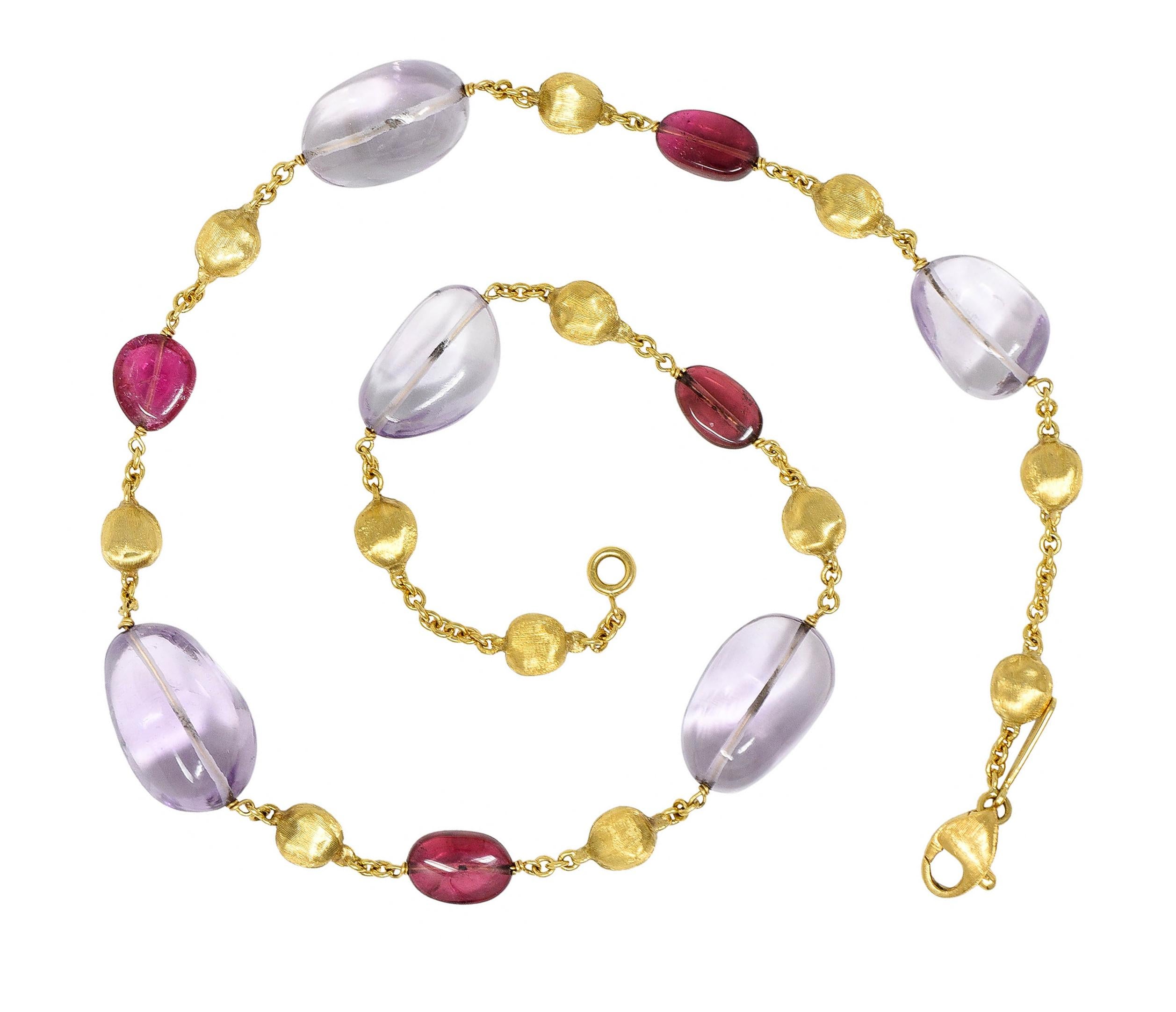 Necklace is comprised of tumbled gemstones alternating with brushed gold nugget stations

Larger tumbled gemstones are amethysts - fairly transparent with light lavender color

Smaller tumbled gemstones are tourmaline - richly pink in color and