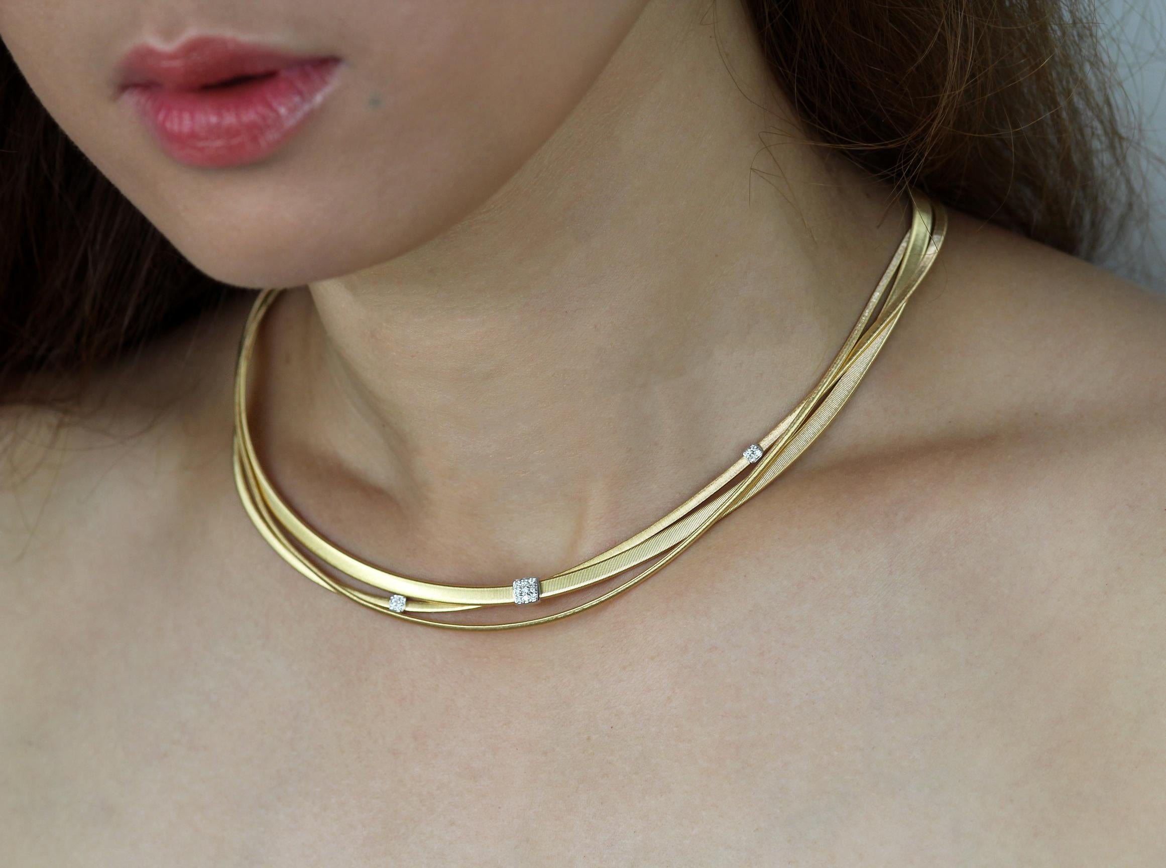 Three-strand diamond necklace set in 18-karat yellow gold by designer Marco Bicego
