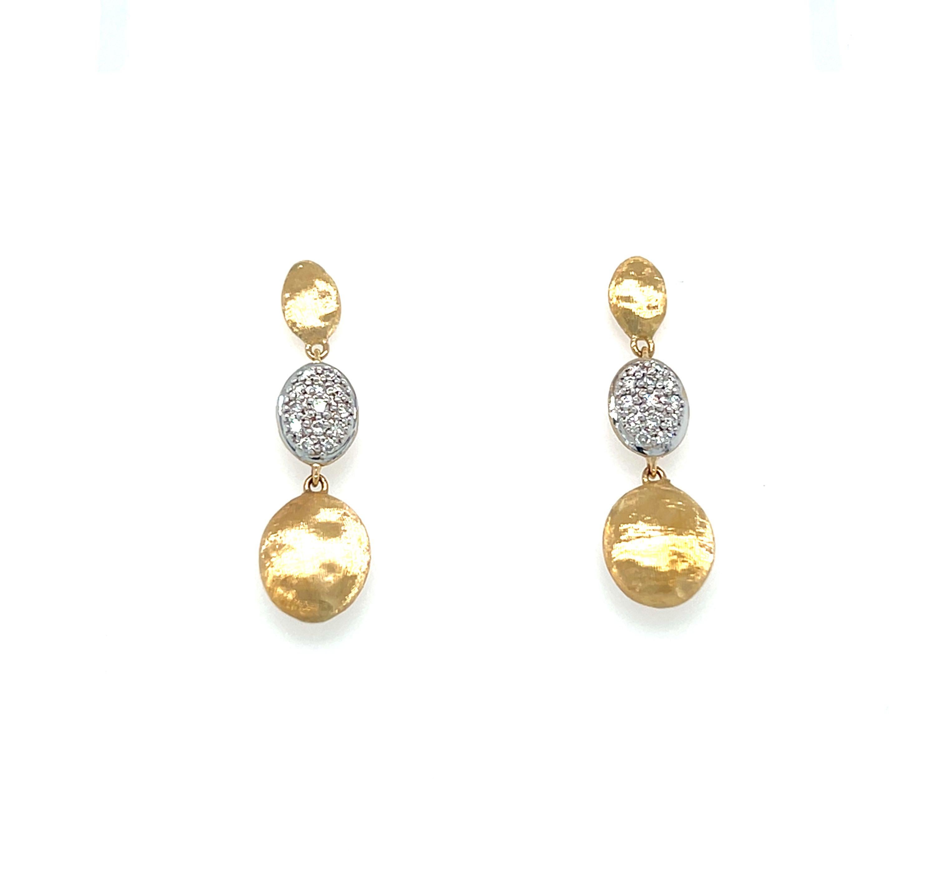 The Marco Bicego Diamond Siviglia Earrings. Handcrafted from 18K yellow gold, these elegant drop earrings feature exquisite hand-engraving and are adorned with 0.2 ct. t.w. pavé diamonds for a dazzling sparkle. With a length of 1 inch and secure