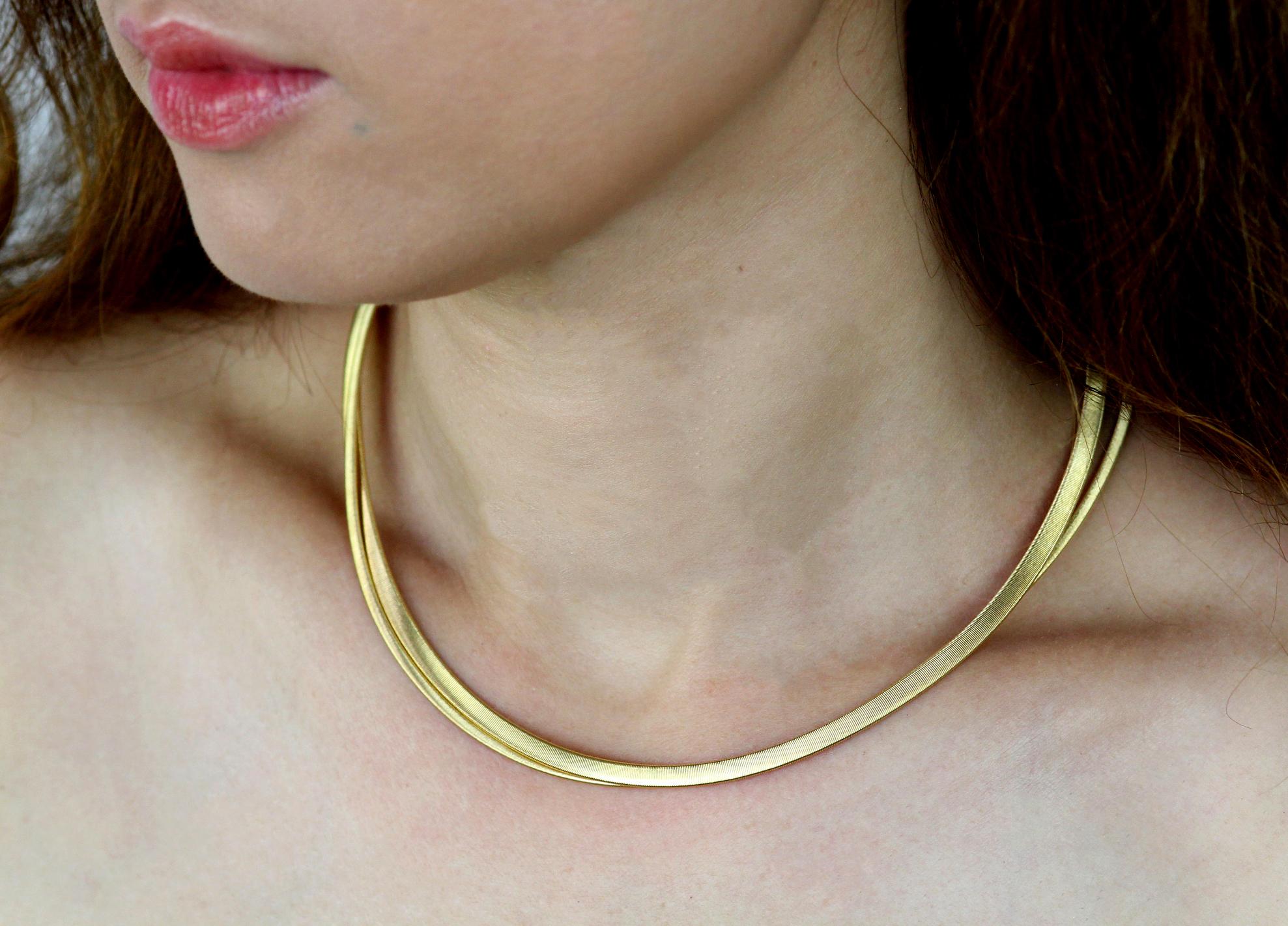 Double strand necklace by Marco Bicego in 18 carat yellow gold. 

