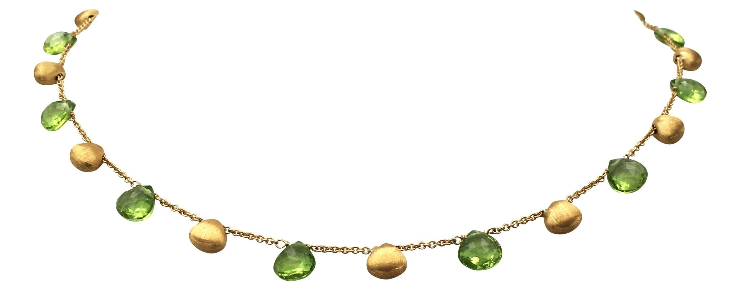 Authentic Marco Bicego Paradise necklace crafted in 18 karat yellow gold with 12 faceted peridot beads alternating with 13 textured gold beads.  Necklace measures 14 1/4 inches and is signed Macro Bicego, 750.  CIRCA 2010s