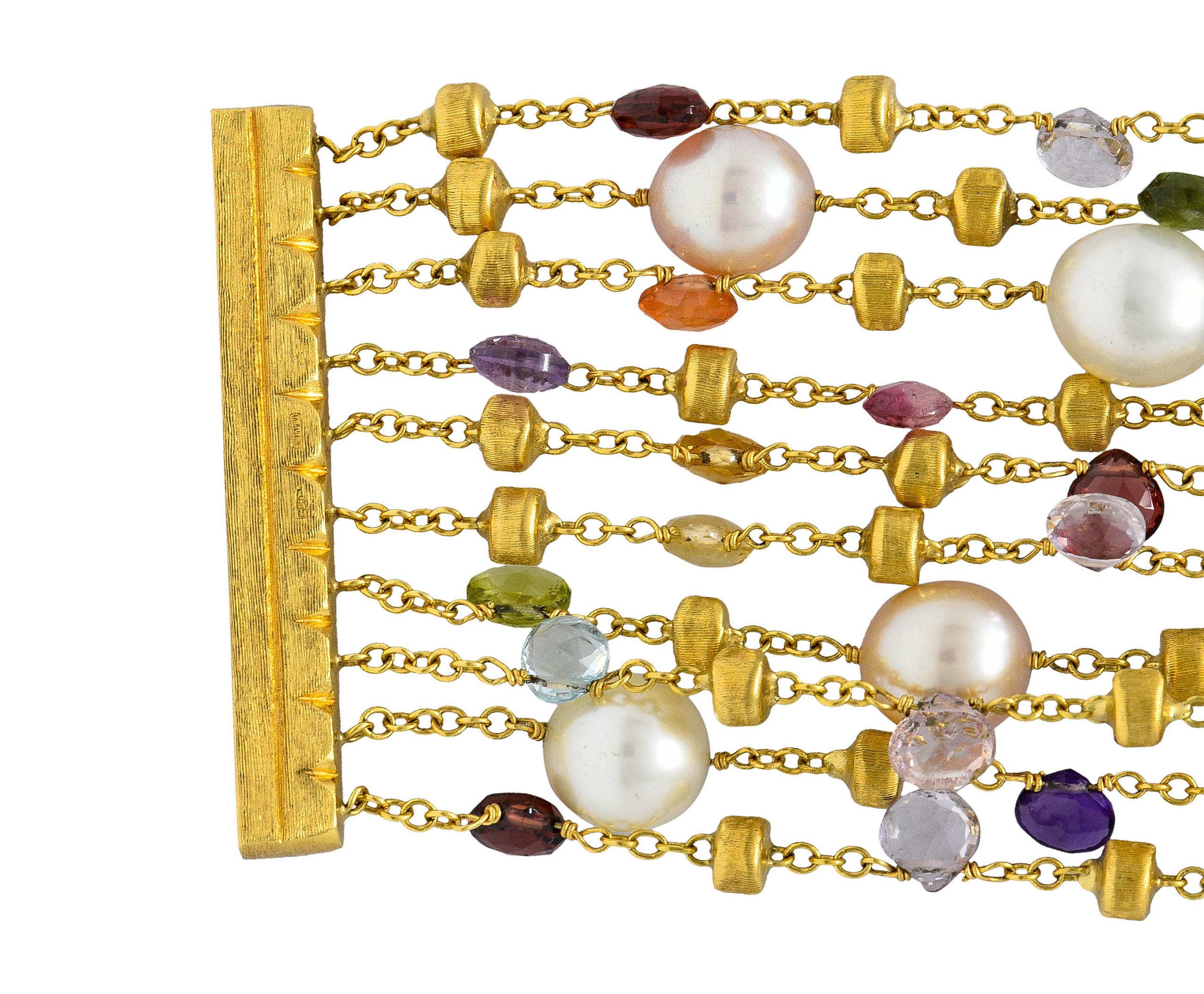 Bracelet is designed as a ten strand bracelet decorated with pearls, faceted gemstones, and brushed gold rondelle stations

Oval cultured pearls are white and cream in body color with some exhibiting rosè overtones - very good to excellent
