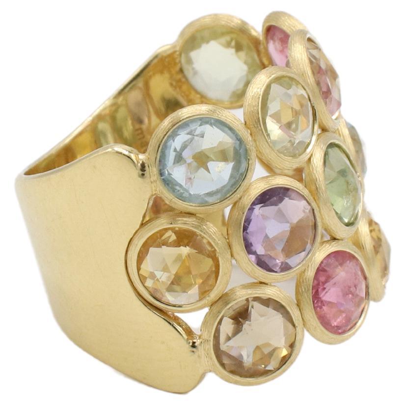 Marco Bicego Jaipur 18 Karat Multi-Colored Gemstone Band Ring 
Metal: 18 yellow gold
Weight: 8.37 grams
Size: 6.5 (US)
Width: 18mm
Signed: Marco Bicego made in italy 750
Gemstones: Amethyst, citrine, topaz, tourmaline
