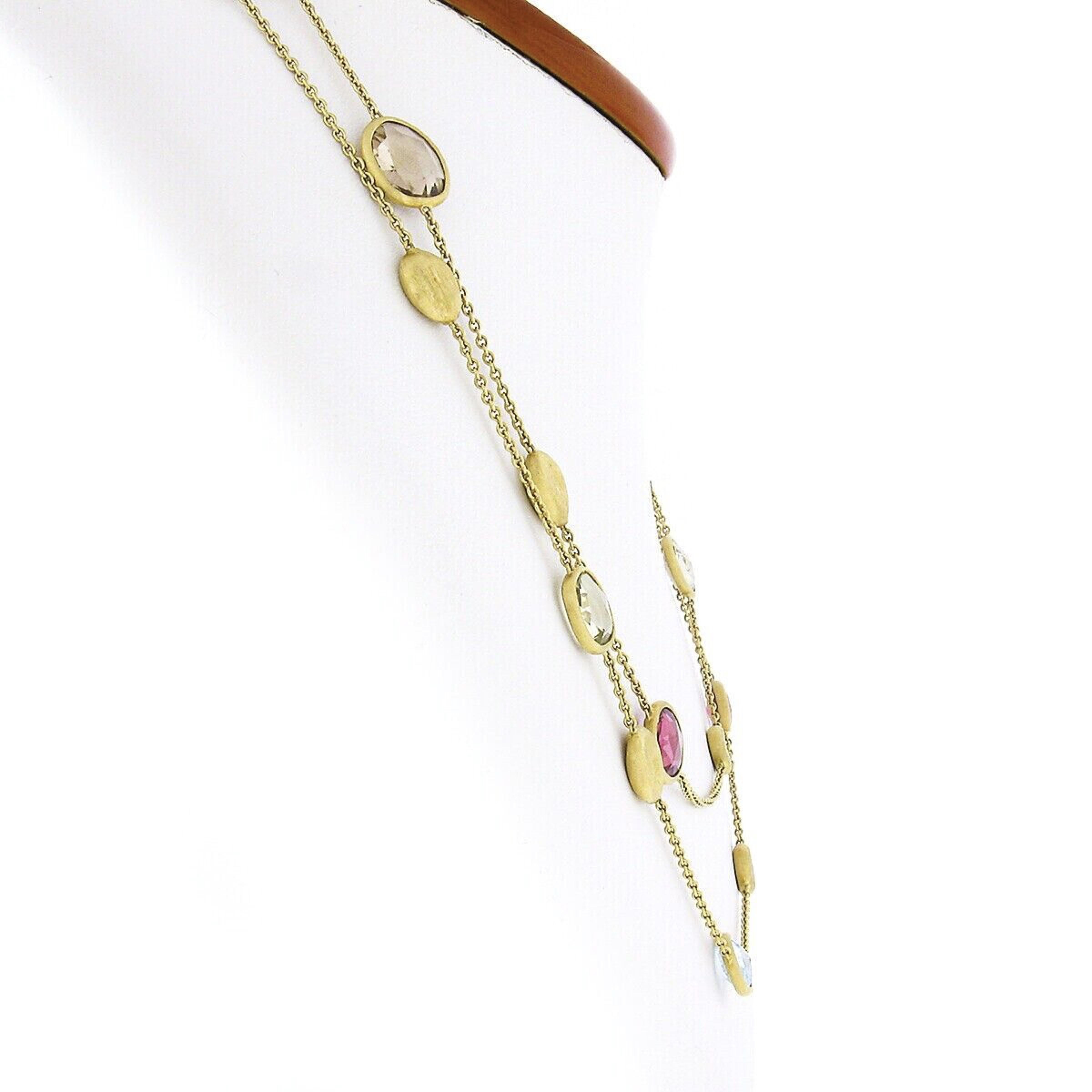 This gorgeous bead station necklace was crafted in Italy from solid 18k yellow gold by Marco Bicego. The long necklace comes from the Jaipur Collection and features fine cable link chain with multiple semiprecious stones that are neatly bezel set