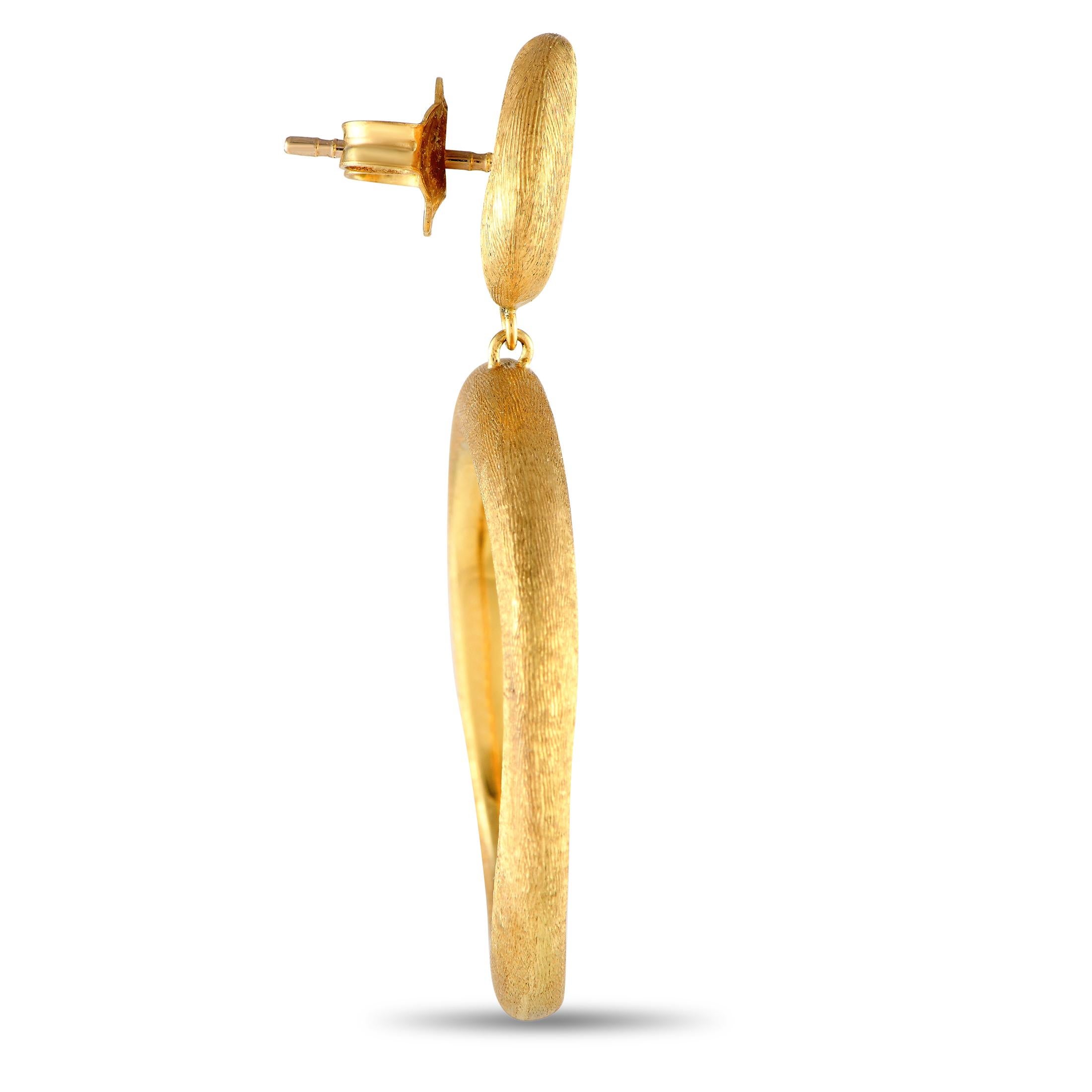 Engraved by hand for a silk-like brushed finish, textured 18K Yellow Gold adds impressive dimension to the minimalist design of these Marco Bicego Jaipur earrings. Each one measures 1.5 long by 1.0 wide and includes post closure.This jewelry piece