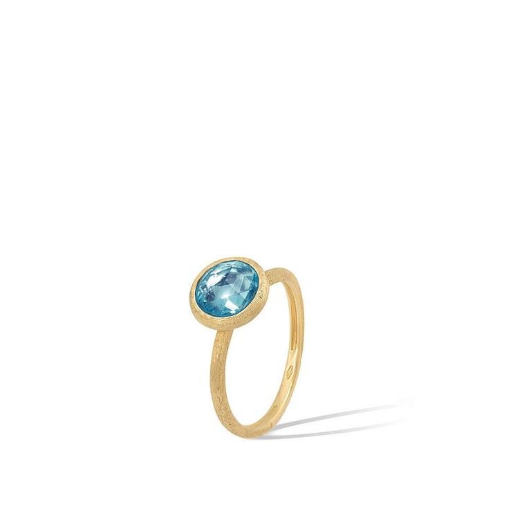 Marco Bicego Jaipur Color Collection stackable ring featuring a bezel set antique faceted topaz. Set in 18K yellow gold with Marco Bicego's signature engraved finish and design.

Color: Blue
Series Label: Jaipur Color Collection
Ring Size: 7
Rings: