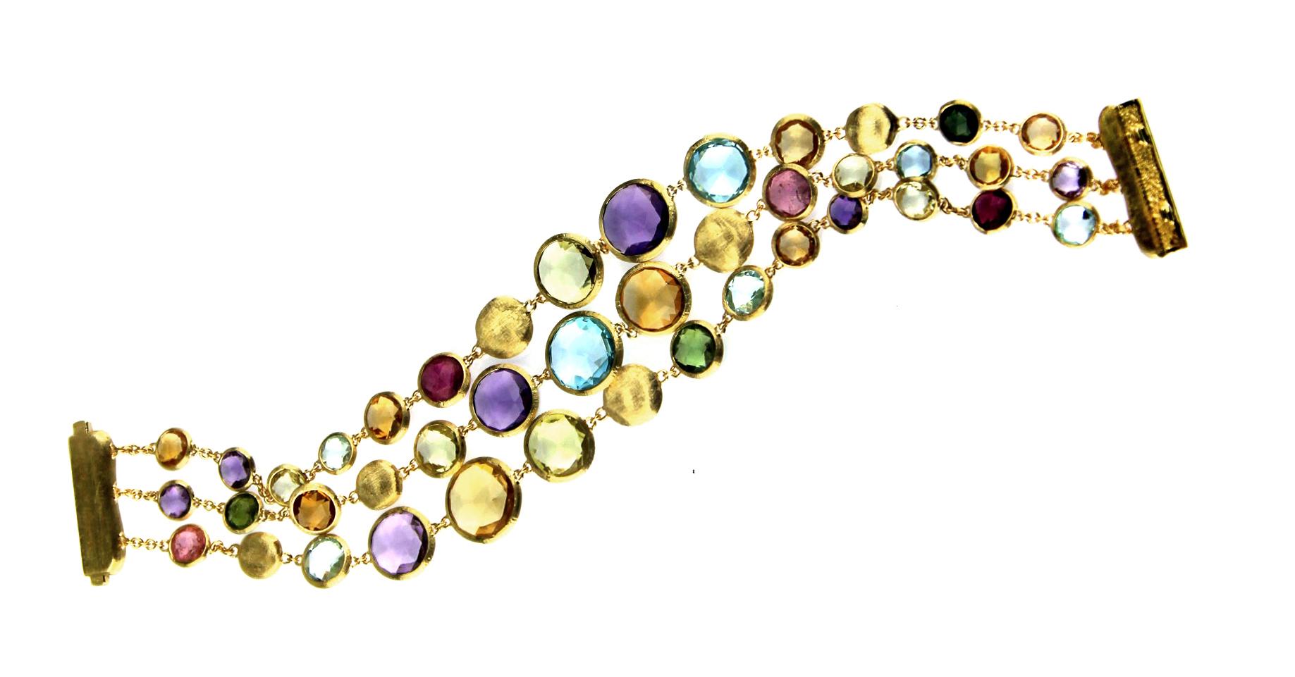 Italian artisan Marco Bicego has handcrafted this vibrantly hued piece, the Jaipur Bracelet. Three round-link chains feature assorted round-cut, bezel-set stones: amethyst, citrine, garnet, iolite, pink and green tourmaline, pink and smoky quartz,