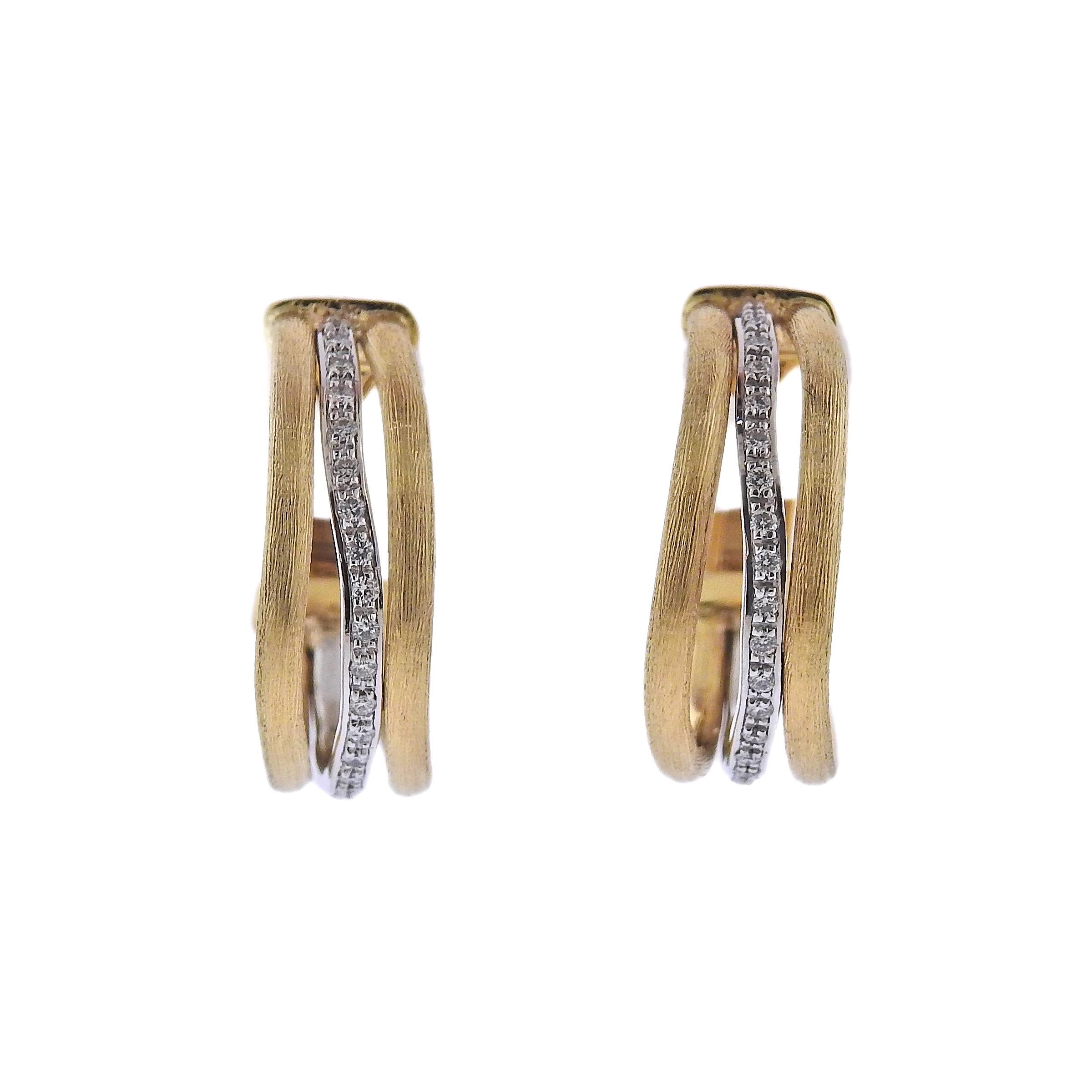 Marco Bicego Jaipur collection 18K yellow and white gold hoop earrings set with 0.25ctw of VS/G-H diamonds. Earrings measure 20mm in diameter and 8mm at the widest point. Mareked: Marco Bicego, Made in Italy, 750. Weight is 10.9 grams. Retail Value