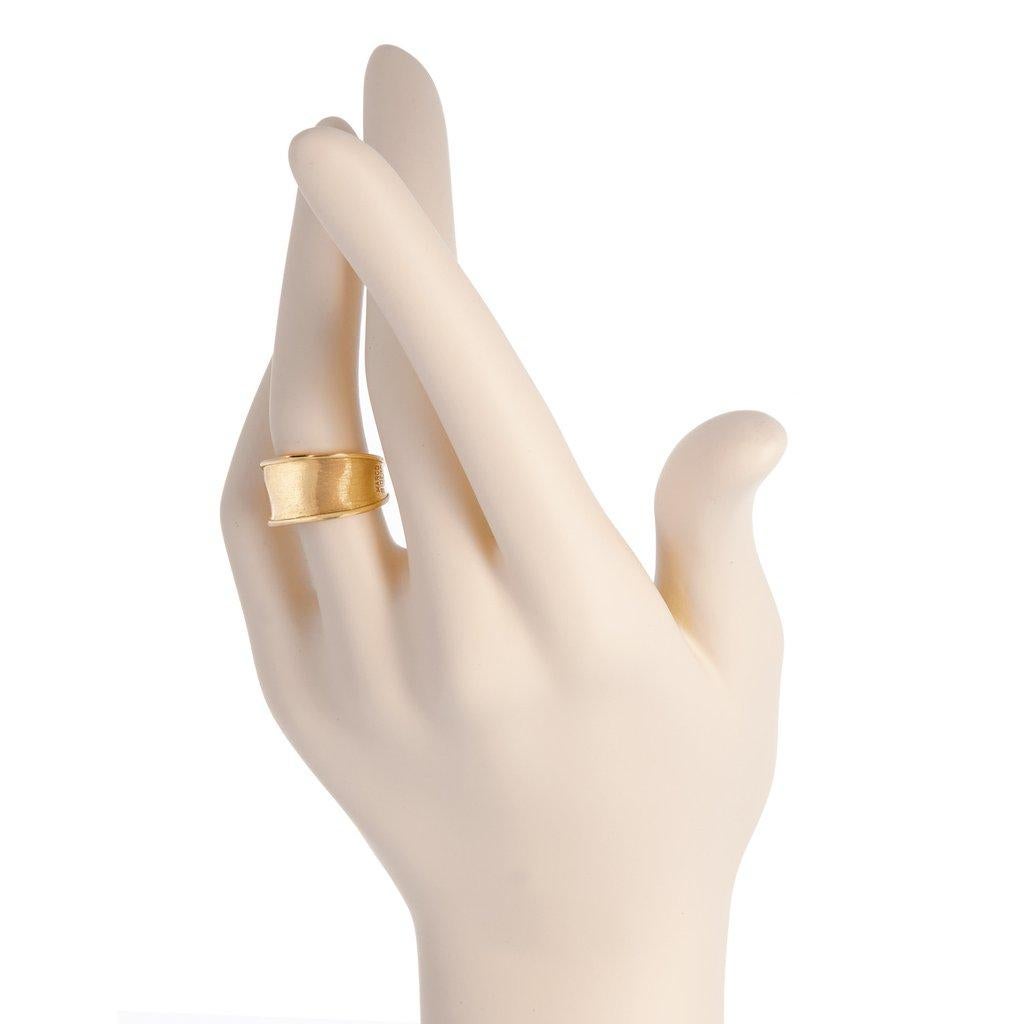 Marco Bicego 18K yellow gold narrow band ring. 
Inspired by the delicate shape of the Lunaria flower, this Lunaria Gold Ring is hand hammered and hand engraved by Italian artisans.
Size 7
AB549 Y 02