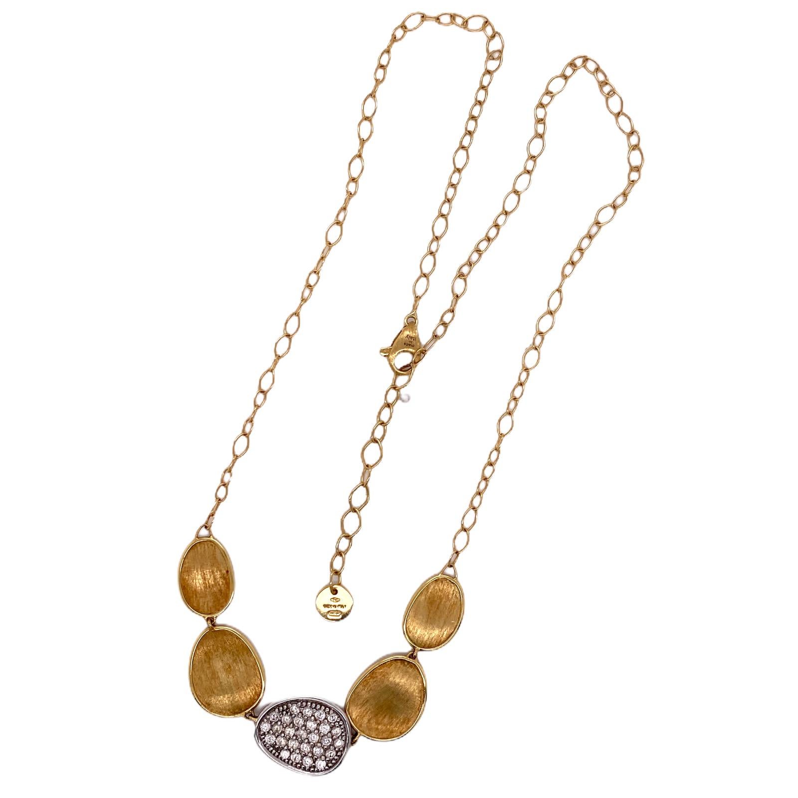Stylish necklace by Italian Designer Marco Bicego. The necklace is part of the Lunaria collection. This 5 station necklace features a center pave diamond station weighing .53 carat total weight. The necklace measures 17 inches in length, but can be