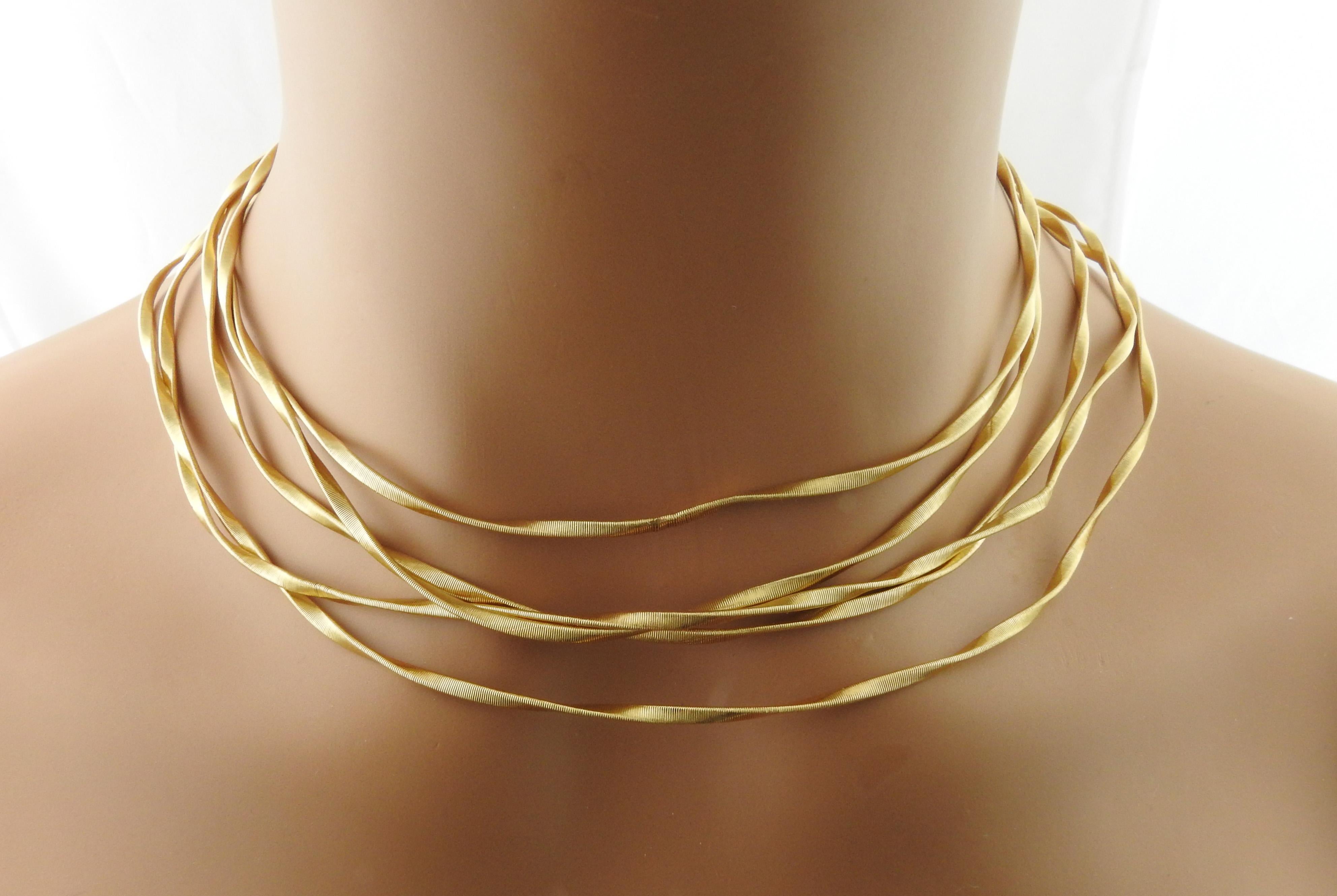 Marco Bicego Marrakech 18K Yellow Gold 5 Strand Collar Necklace

This satin gold weaved multi strand necklace is from the Marco Bicego Marrakech collection.

Set in 18K yellow Gold

Necklace is approx. 16