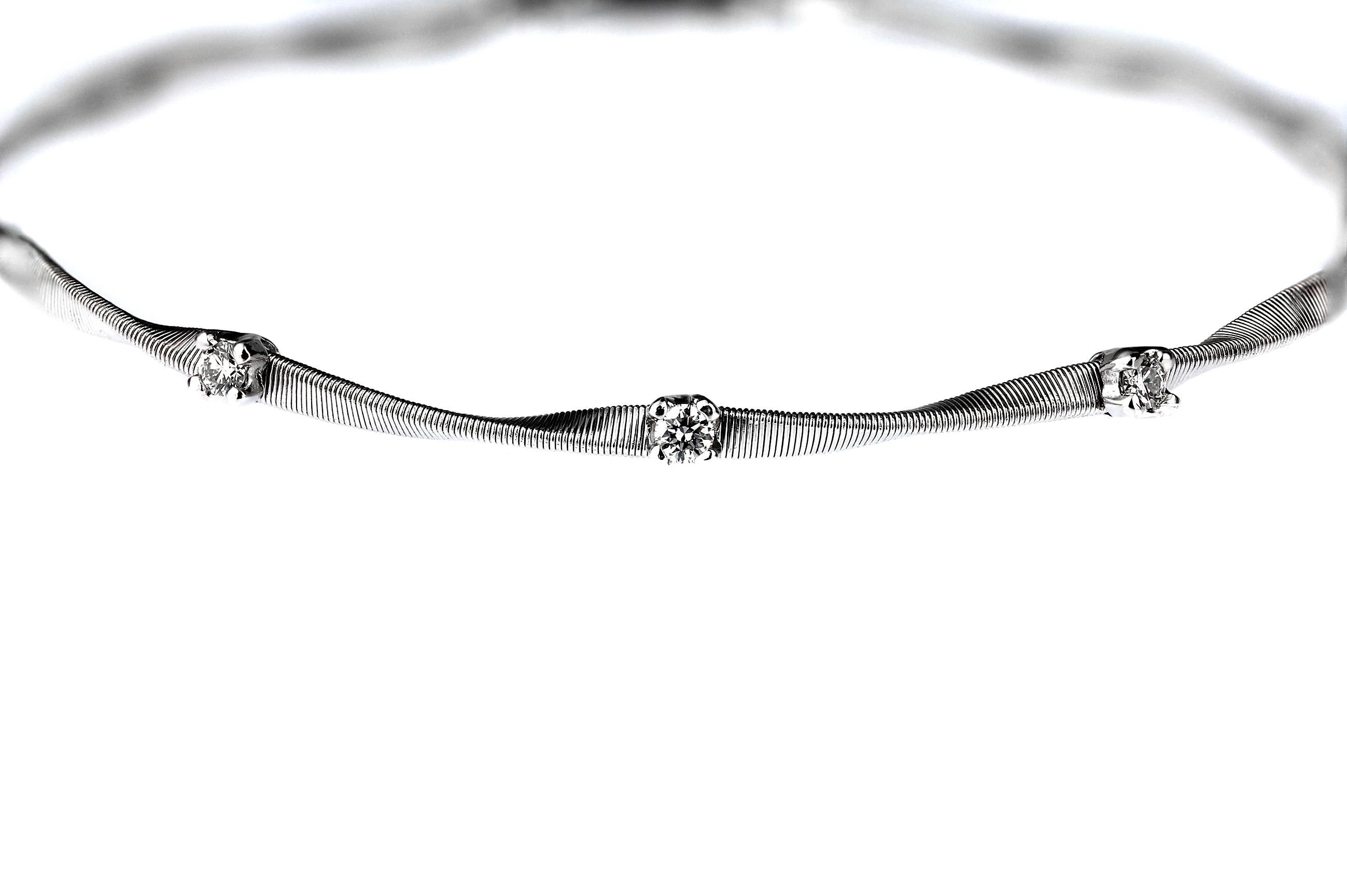 Marco Bicego “Marrakech” collection diamond-set stackable bangle/bracelet in 18 carat white gold.  This bracelet is set with round brilliant-cut diamonds. The texture of the bracelet is formed from hand-hammered and hand-twisted strands of gold