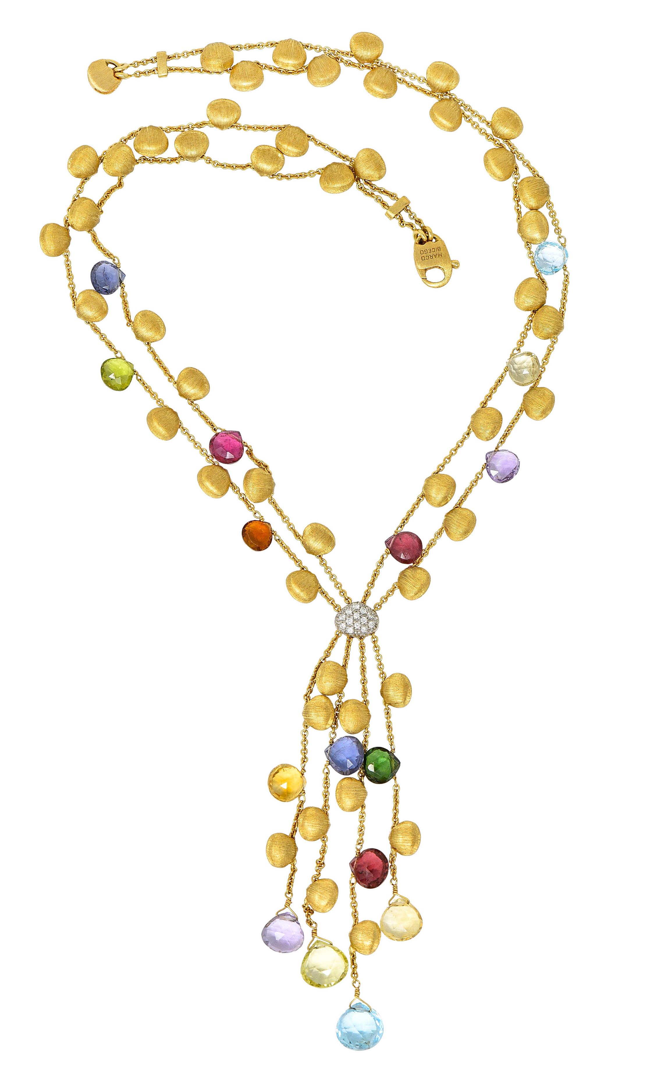 Necklace is comprised of four cable chain strands accented by brushed gold and gemstone stations

Center station is pavè set with round brilliant cut diamonds weighing in total approximately 0.25 carat 
- eye clean and white

Suspending a tassel of