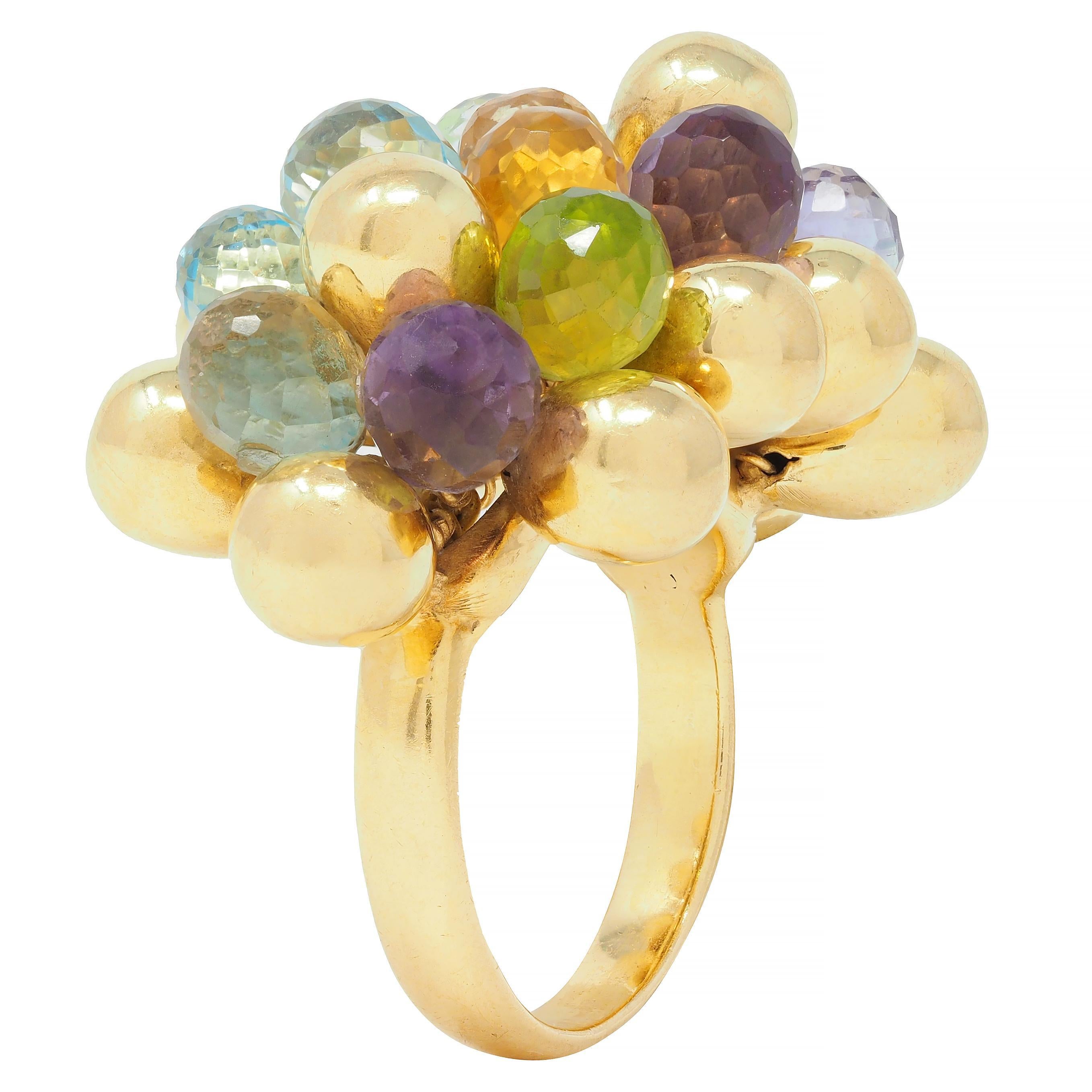 Designed as burst motif with dimensional tear-drop shaped forms 
Comprised of clustered gold forms and multi-gem briolette beads
Featuring topaz, peridot, amethyst, citrine, and quartz throughout
Transparent light to medium blue, green, purple,