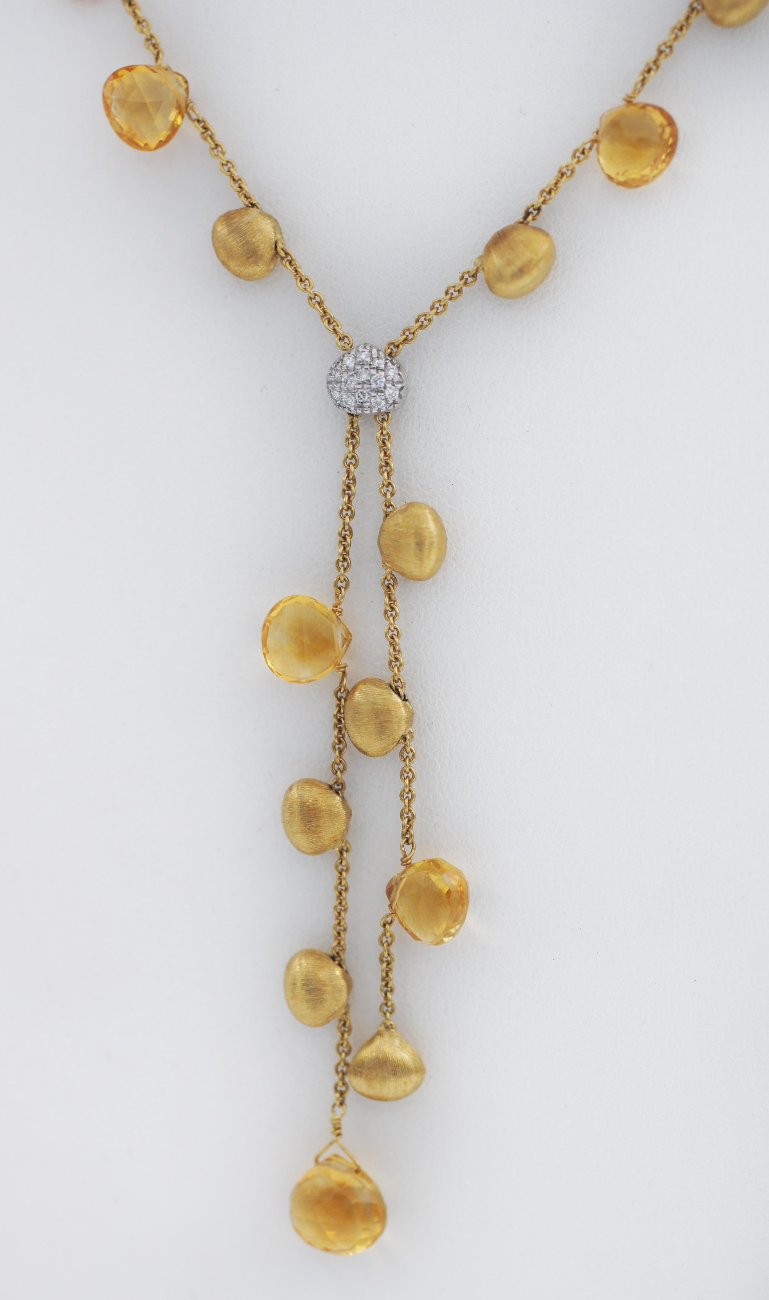 Marco Bicego 
Paradise 
18k yellow gold necklace 
Approx. weighs 17.6g
13 round diamonds, 
Approx. total diamond weight 0.10ct
9 Citrine gemstones
Small Citrine gems measures approx. 7mm x 8mm  
Drop Bottom Citrine gem measures approx. 10mm x 10mm 